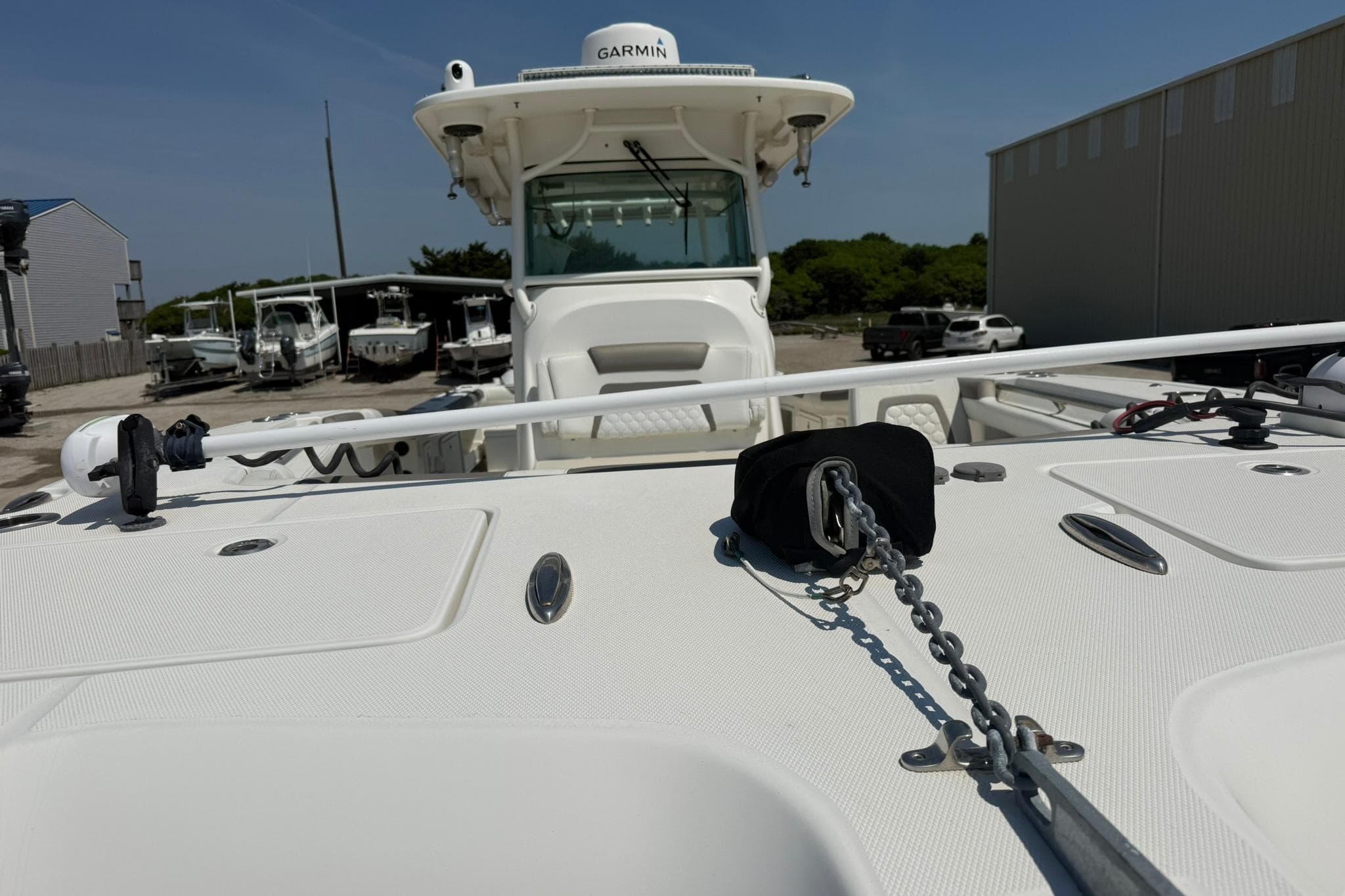 2020 World Cat 325 CC boat with anchor chain, docked in marina.