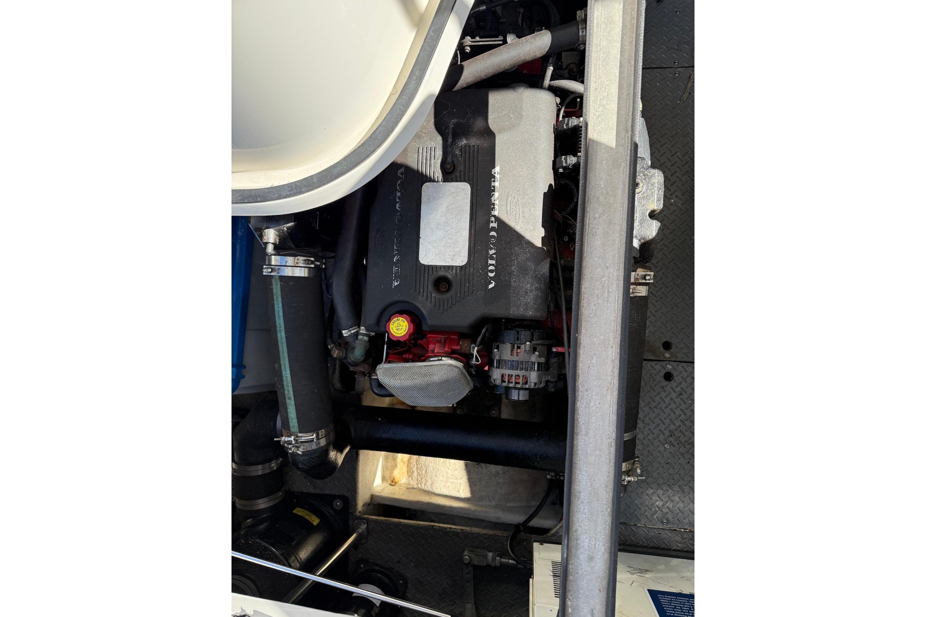 Engine compartment of a 2003 Regal Commodore 3880 boat, featuring a Volvo Penta engine.