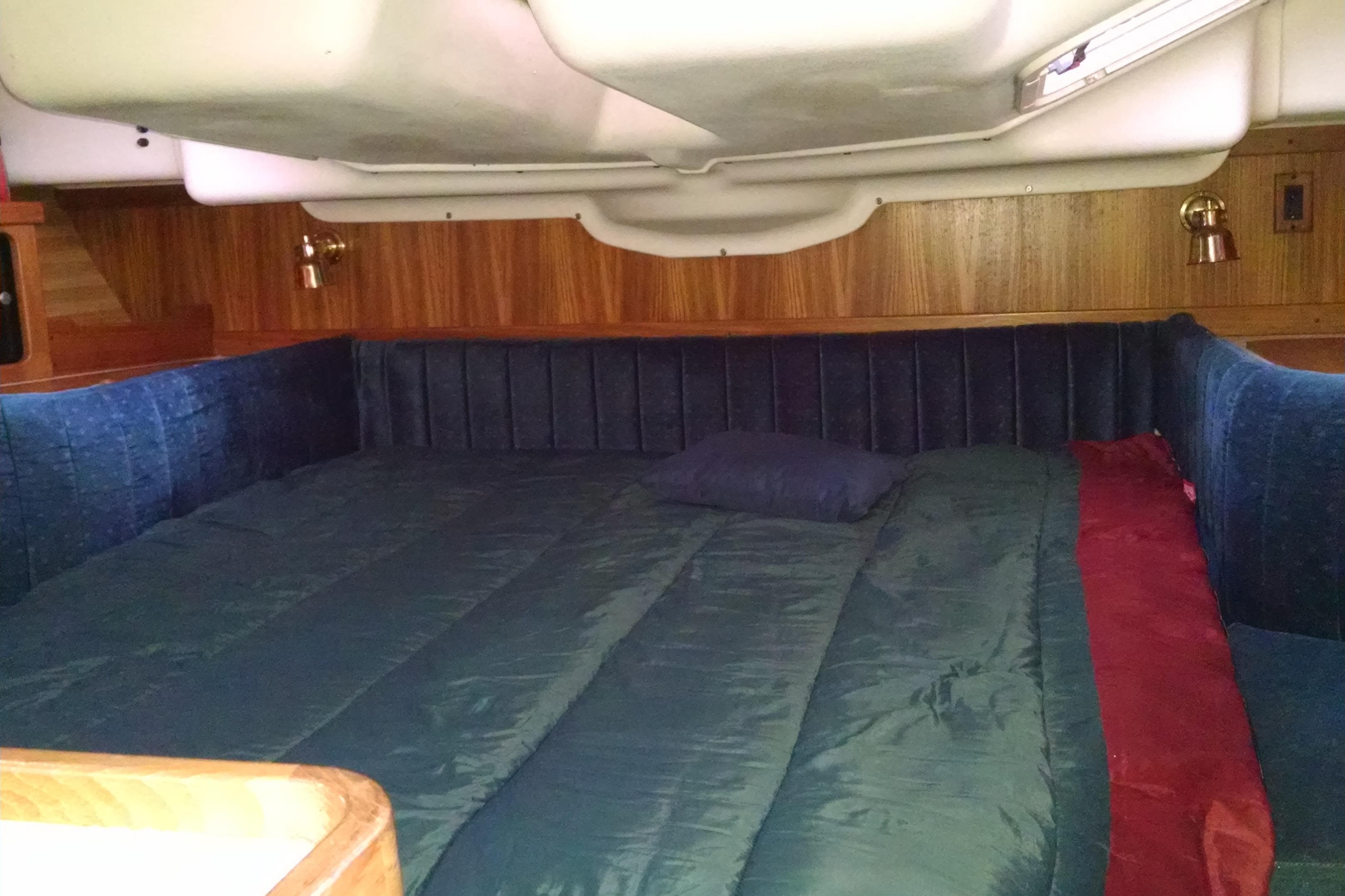 Cozy cabin interior of a 1999 Catalina 400 sailboat with a comfortable bed.