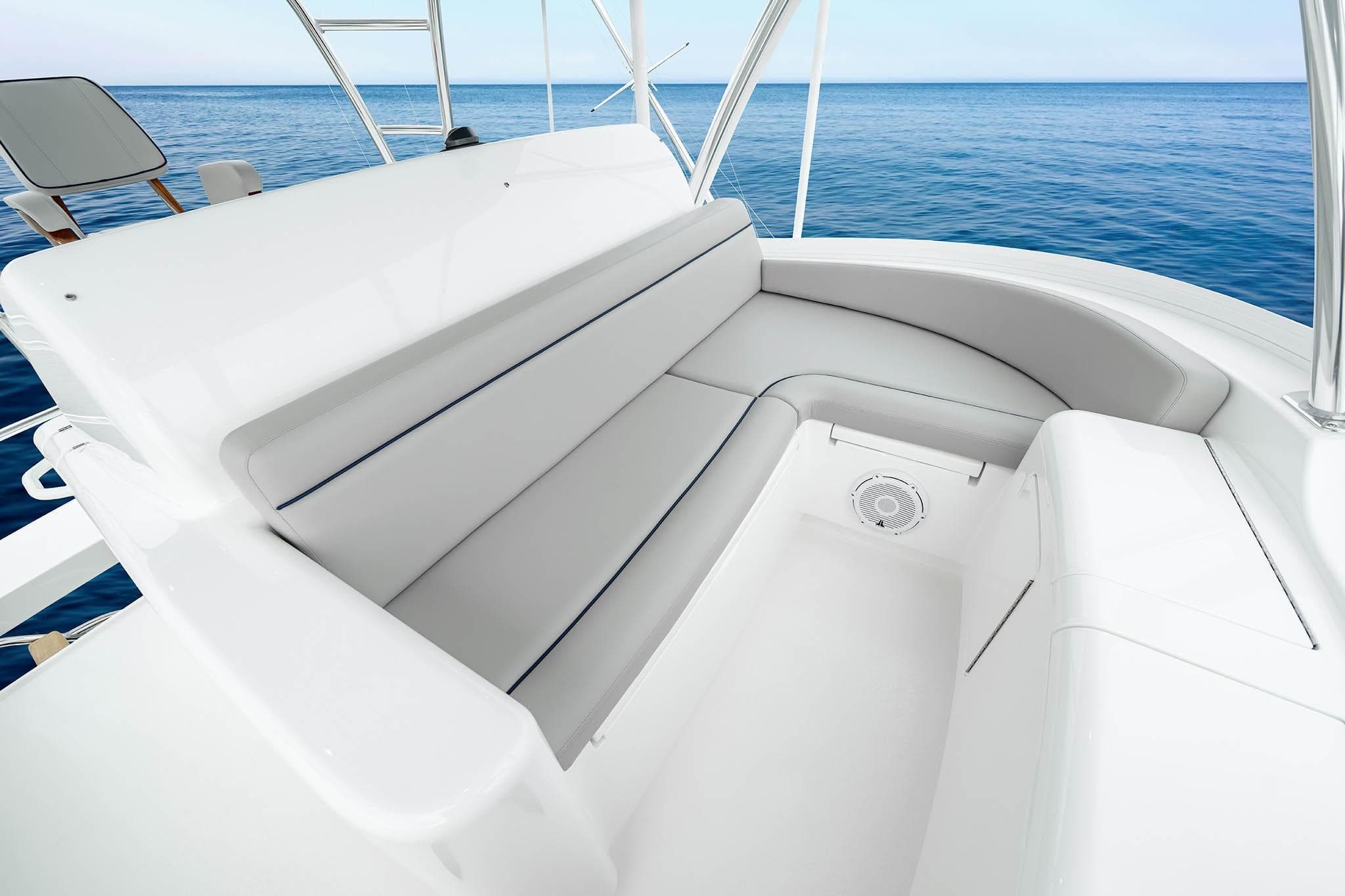 Luxurious seating on 2026 Viking 82 Skybridge yacht with ocean view.