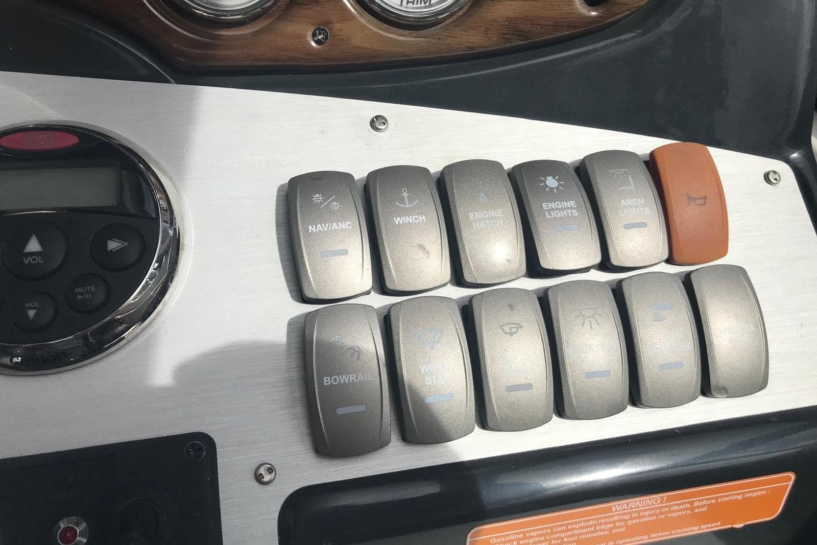 Control panel of a 2007 Doral Intrigue boat with labeled switches and buttons.