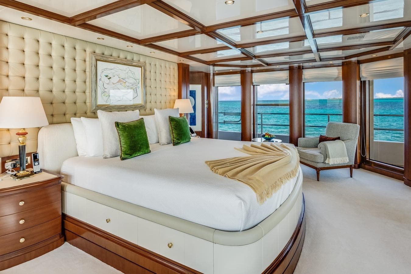 Luxurious Mondomarine motor yacht bedroom with ocean view, elegant decor, and plush furnishings.