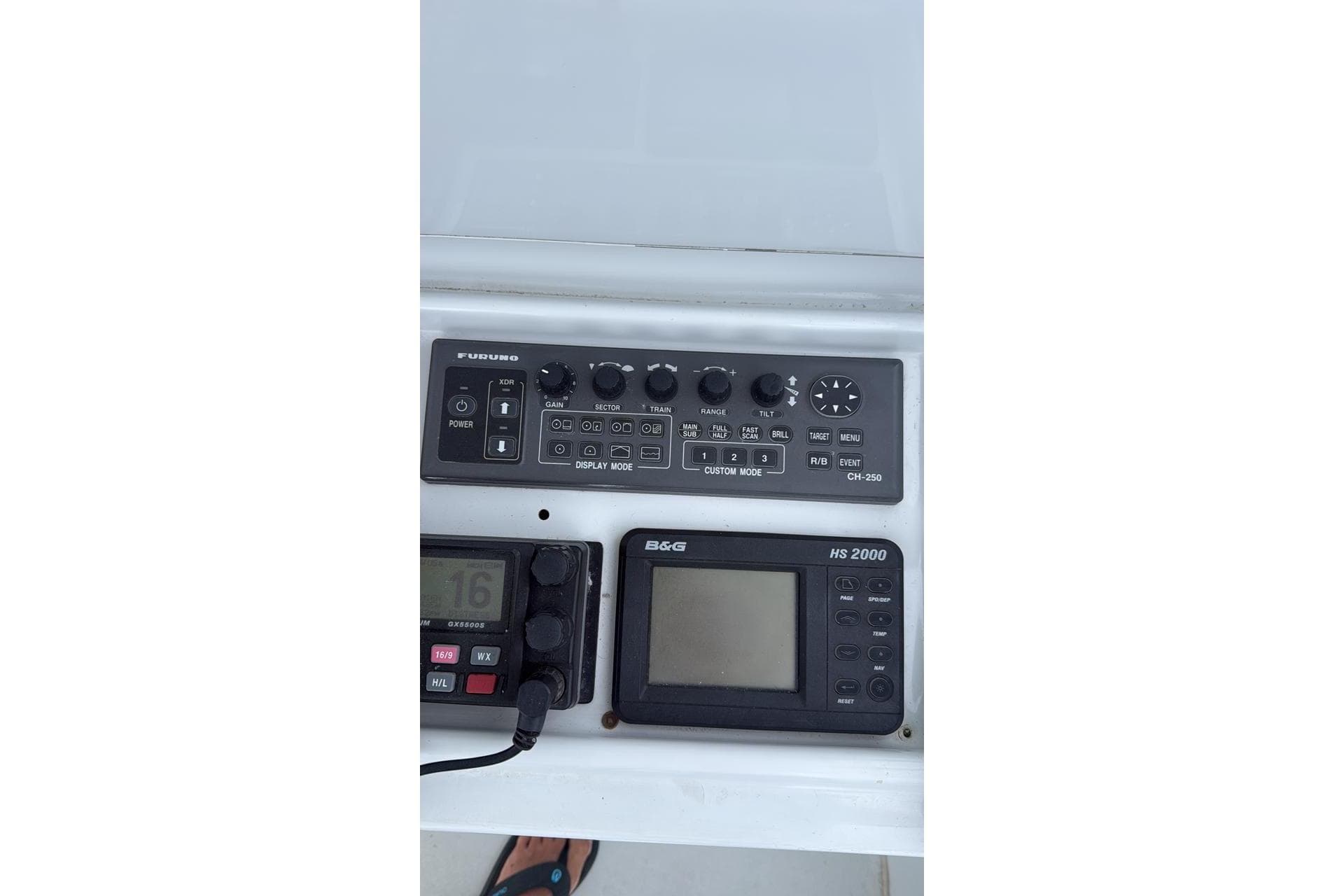 Control panel of a 2001 Hatteras 55 Convertible yacht with navigation equipment.