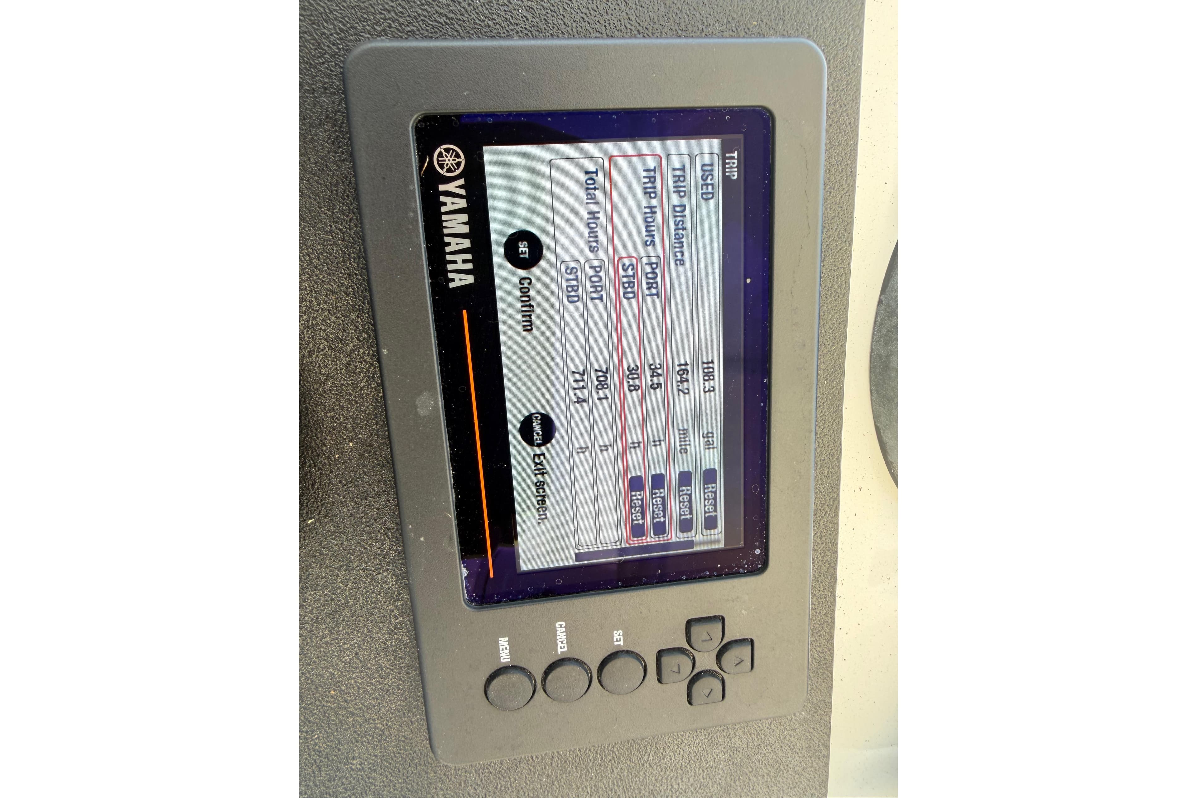 Yamaha display on 2003 Intrepid 323 Cuddy showing trip data and engine hours.