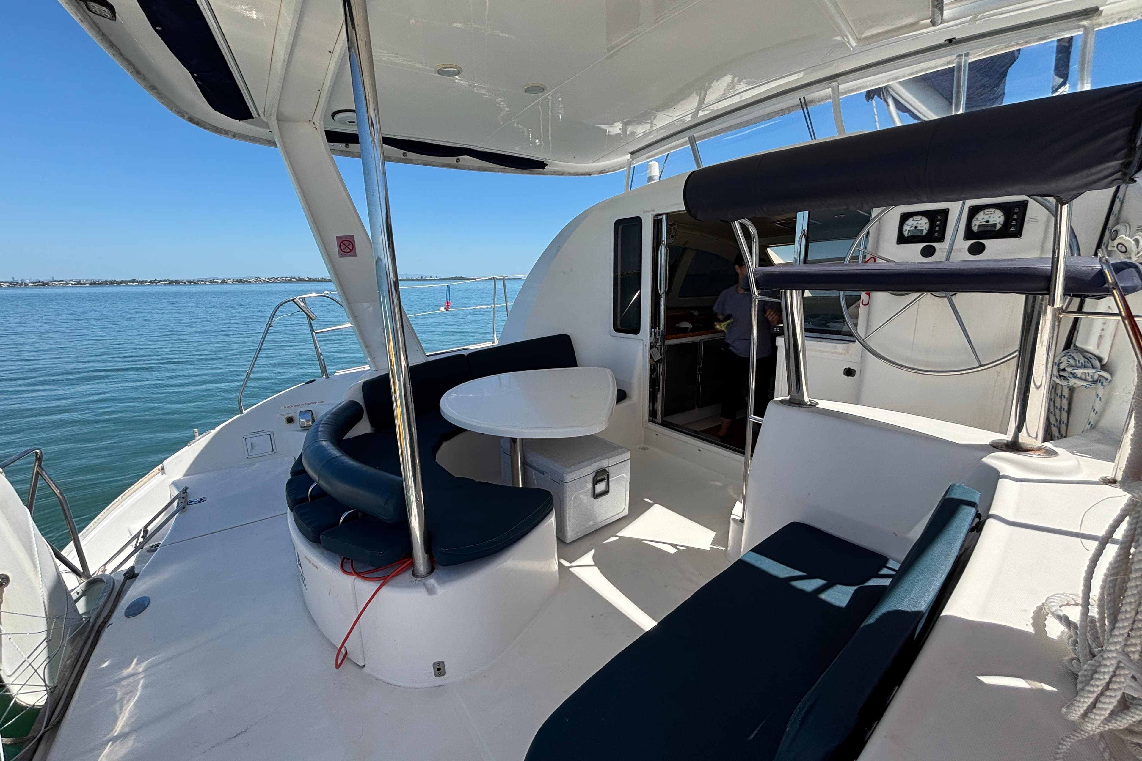 Leopard 40 catamaran cockpit, 2007 model, featuring seating and navigation instruments on calm water.