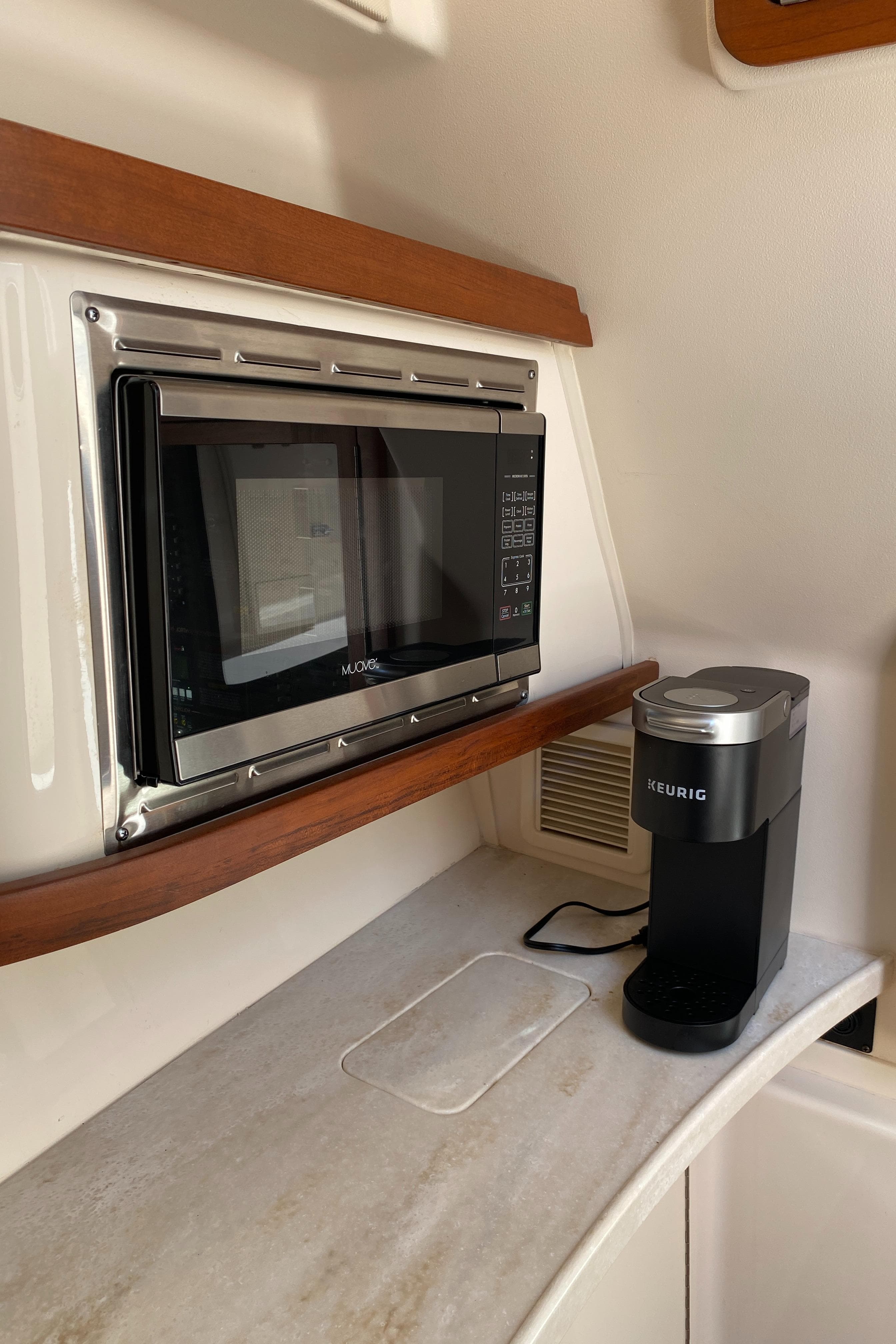 2017 Grady-White Freedom 375 interior with microwave and coffee maker.