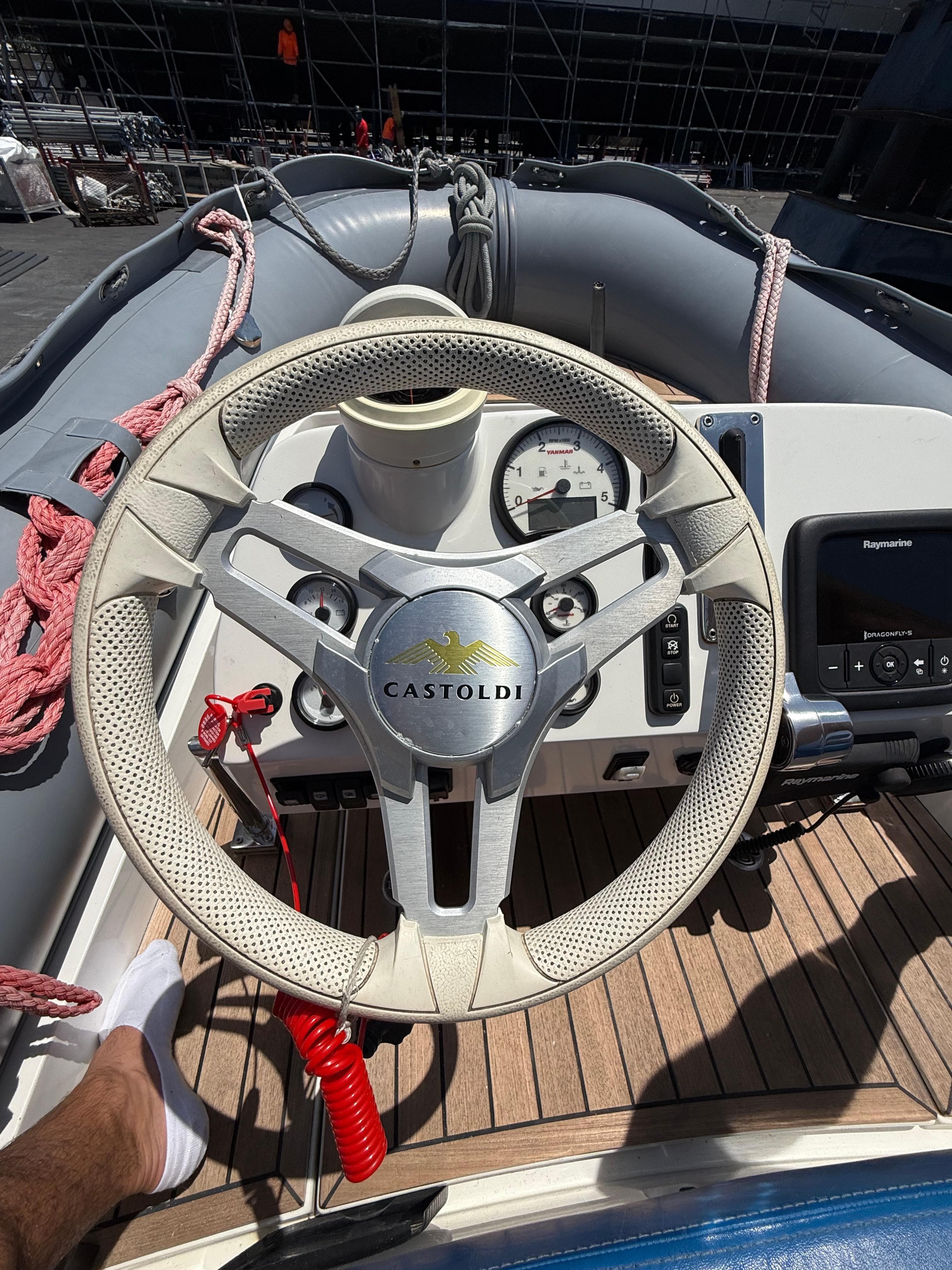 Steering wheel of 2022 Castoldi Jet Tender 14RB SOLAS with dashboard controls.