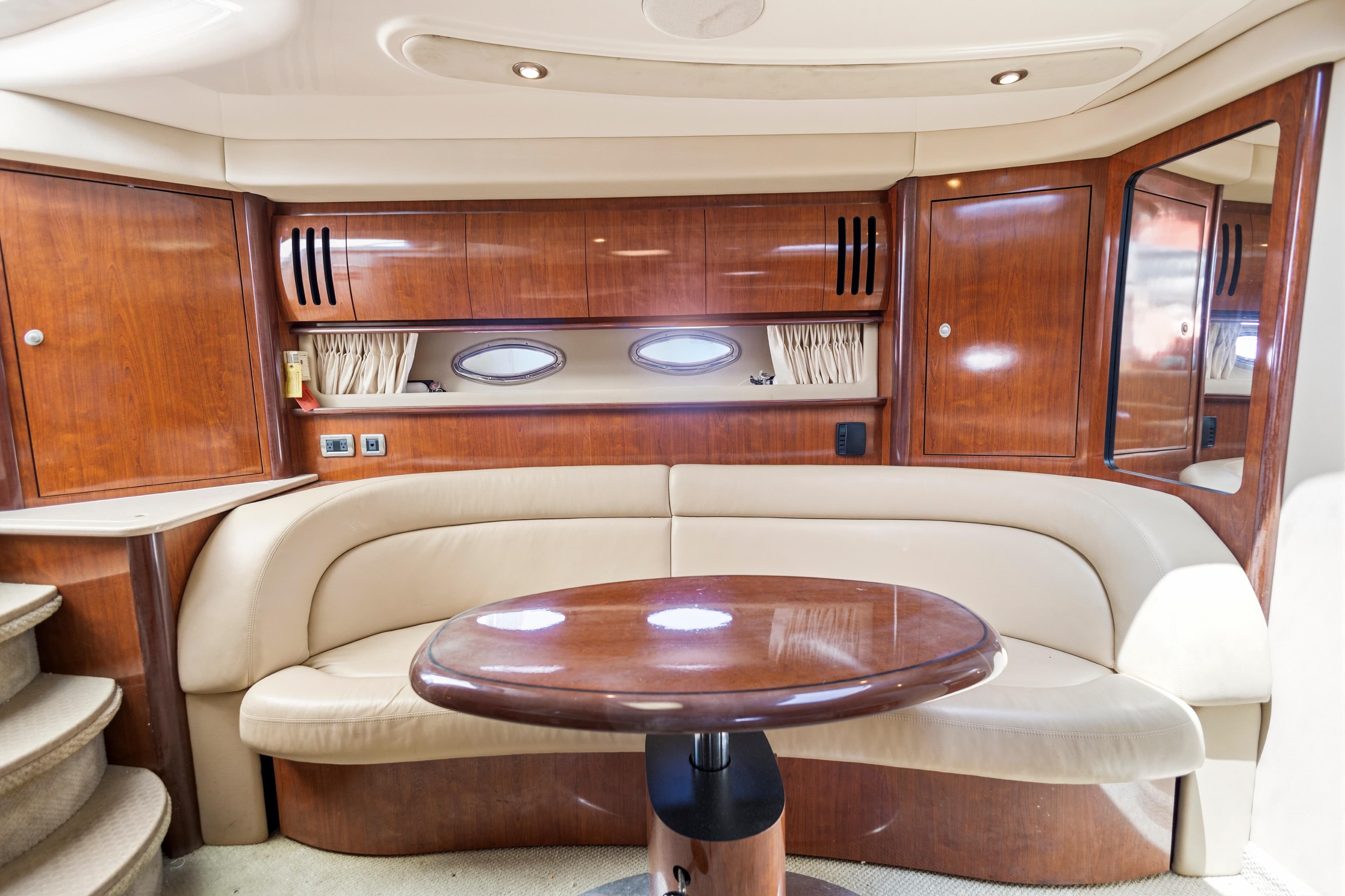 Luxurious interior of 2004 Sea Ray 420 Sundancer yacht with elegant wood finishes.