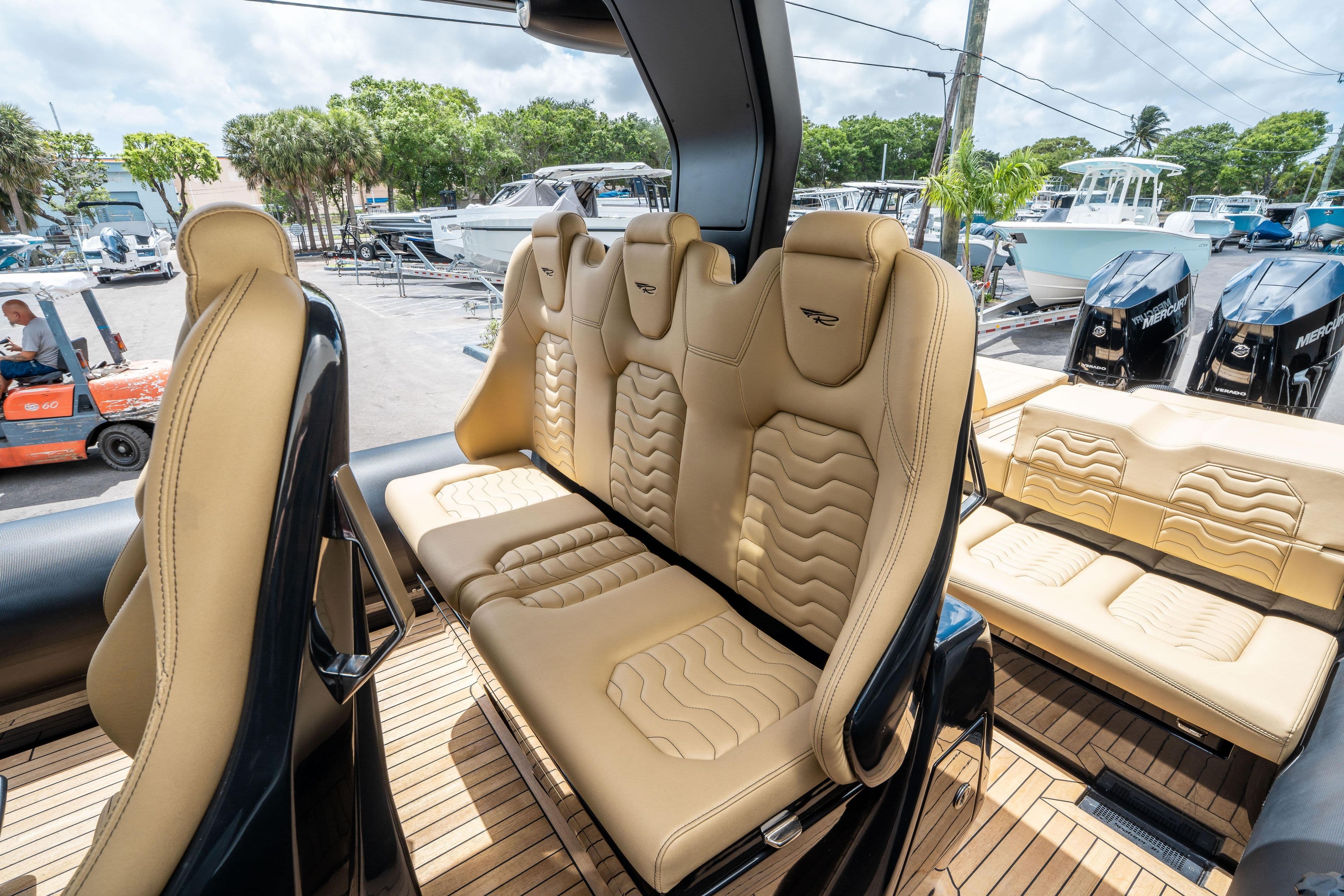Luxurious seating on 2023 Ribco Seafarer 36 X boat with beige upholstery.