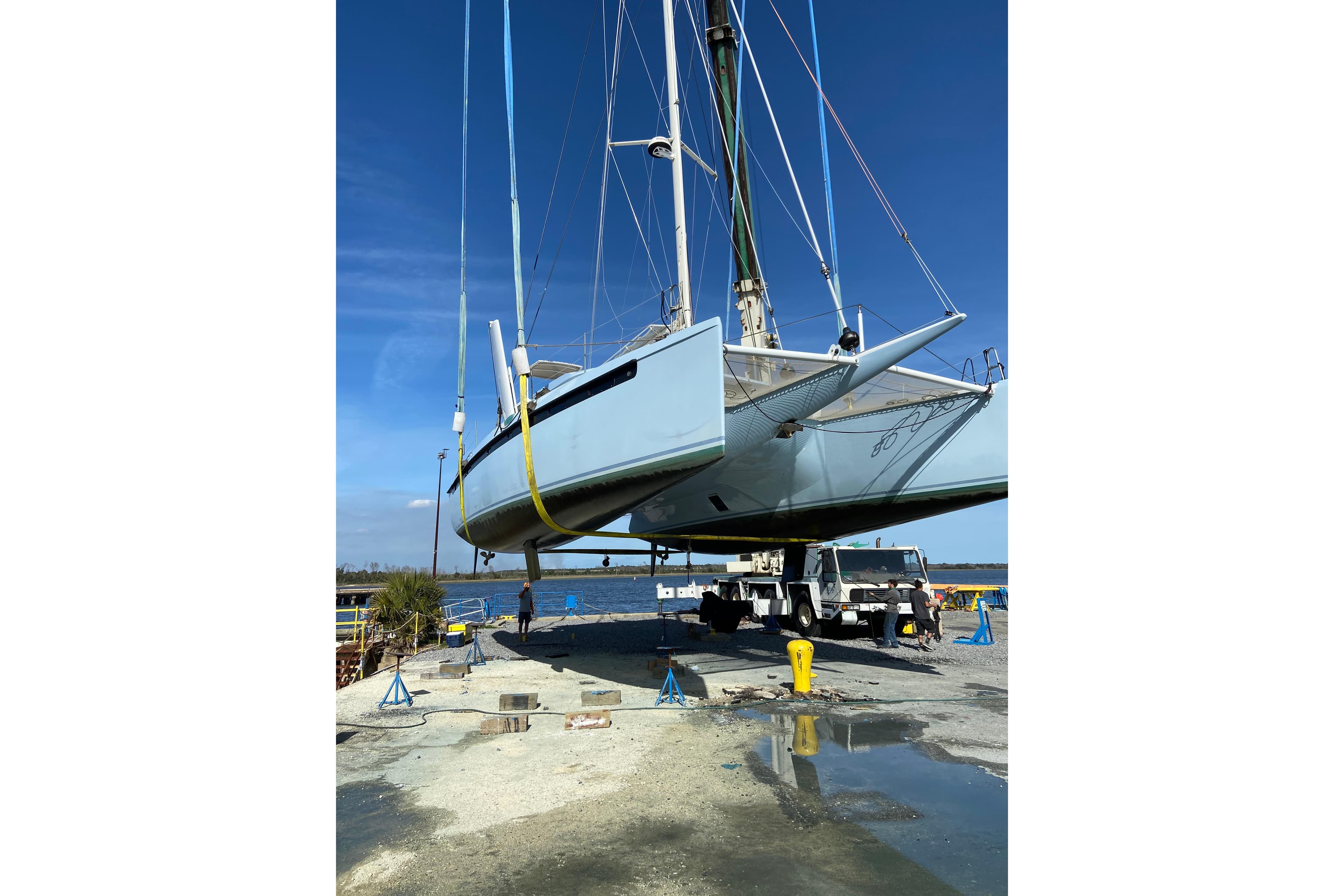Swiss Cat Yachts 48 catamaran, 2018 model, suspended for maintenance at a marina.