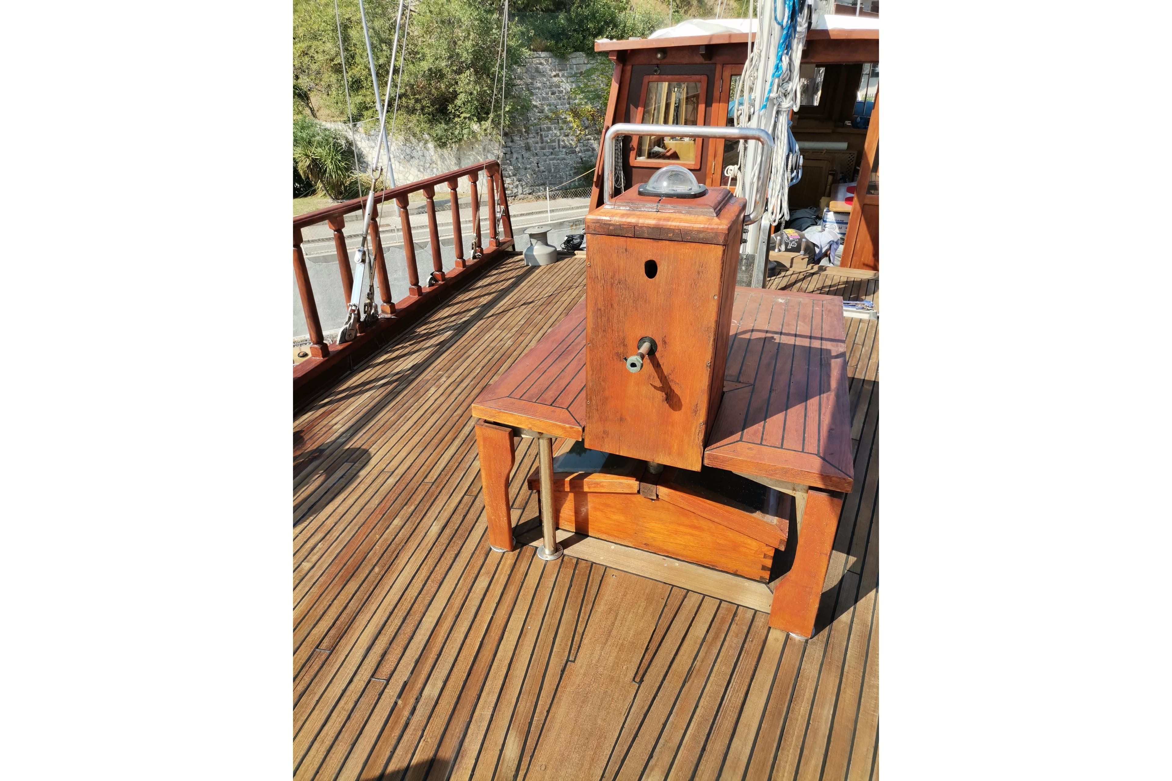 Wooden deck of 1982 Kufra Werft Ketch sailboat with vintage equipment.