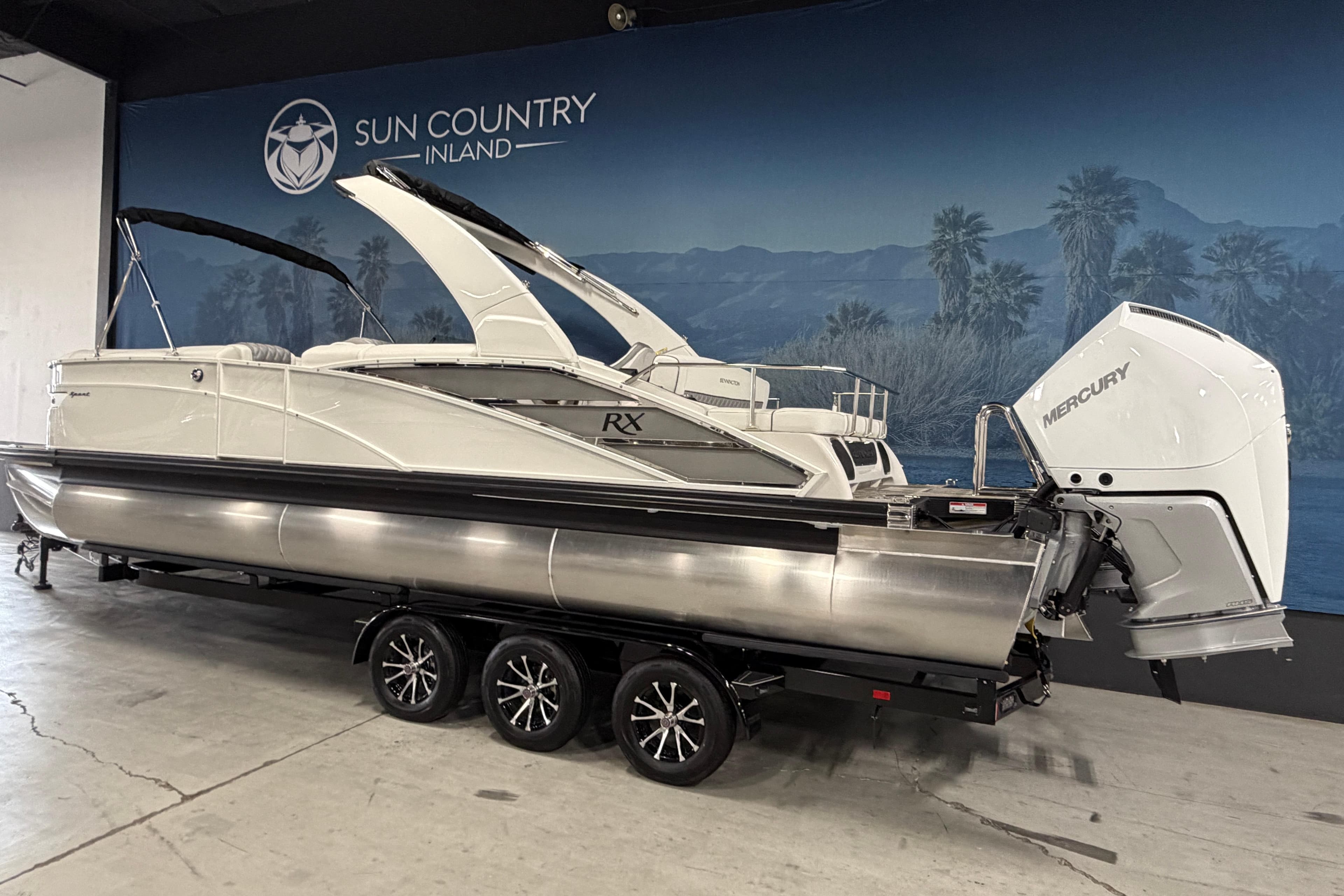 2026 Bennington 27 RXSBAT2 pontoon boat with Mercury engine on trailer at Sun Country Inland.