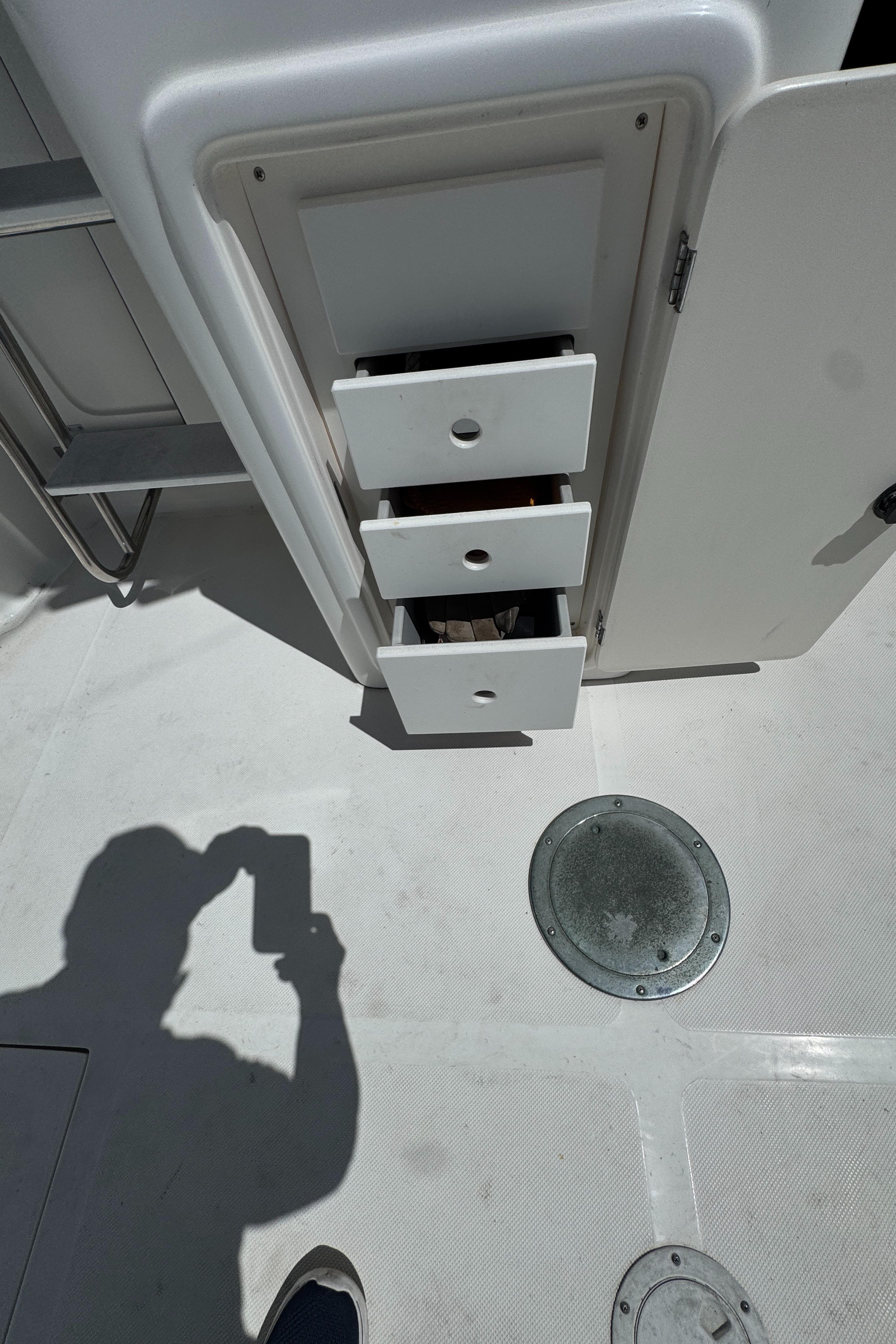 2003 Mediterranean 38 Convertible boat interior with open storage drawers.
