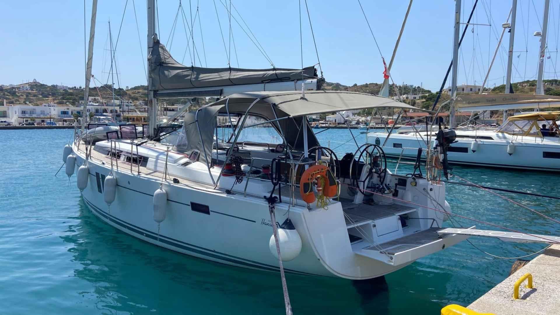 Sailing yacht Hanse 495, 2012 model, docked in a sunny marina.