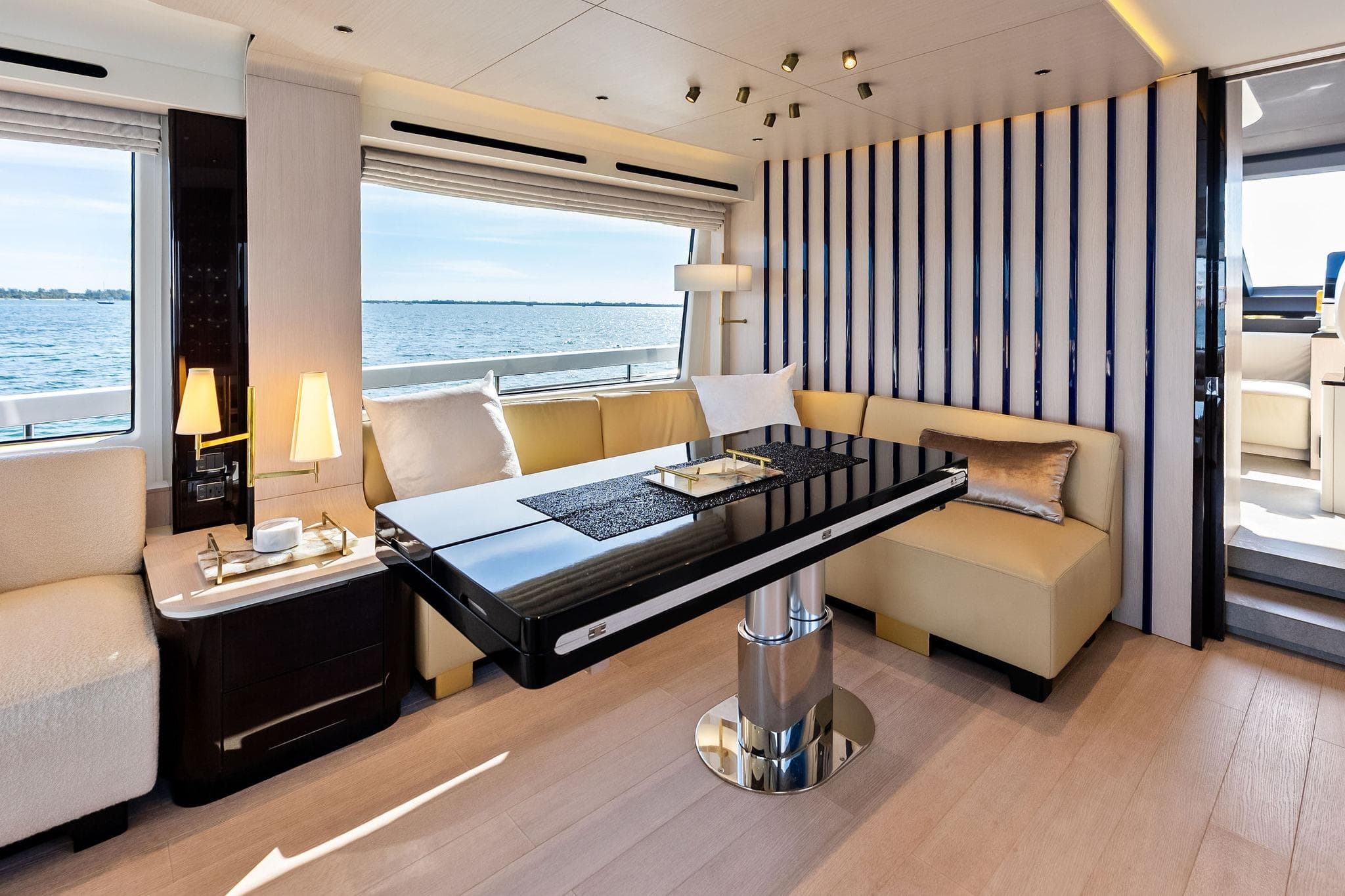 Luxurious interior of 2021 Azimut Fly 78 yacht with elegant seating and ocean view.