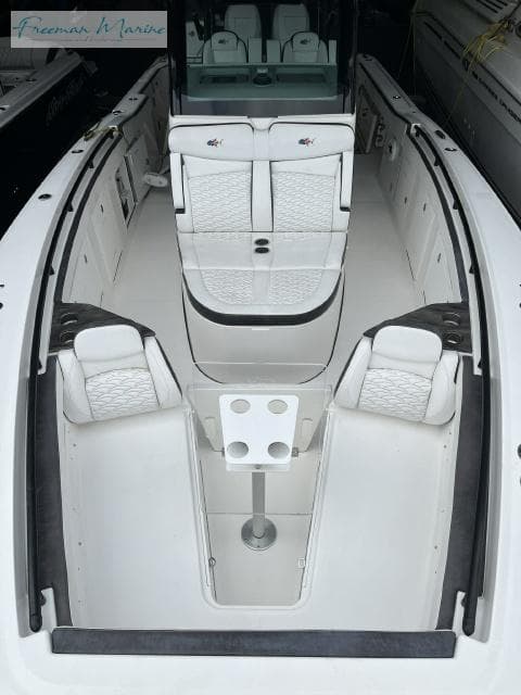 2022 Crevalle 33 CSF boat interior with white seating and table setup.
