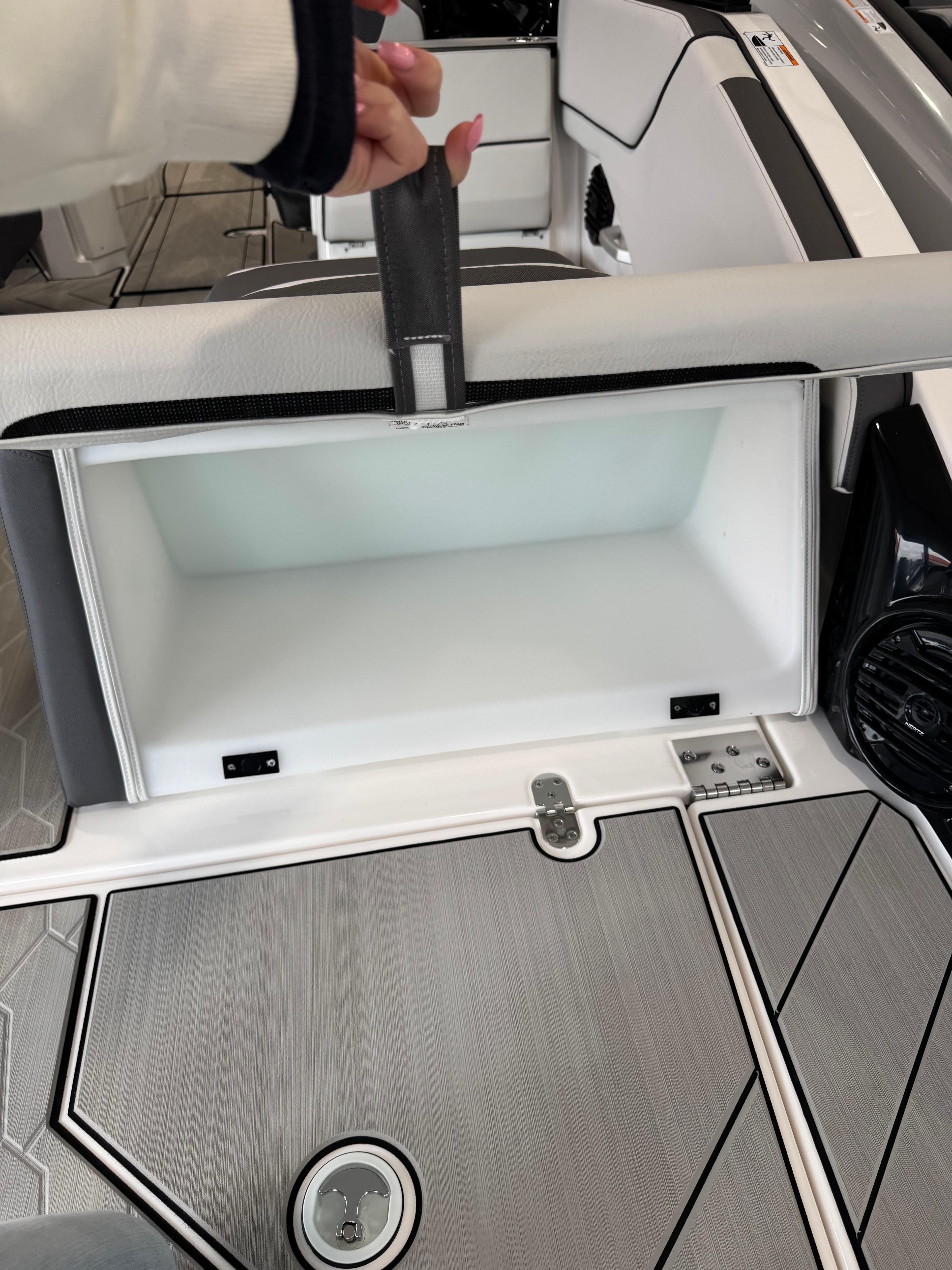 2025 Yamaha Boats 252XE interior storage compartment with sleek design and modern features.