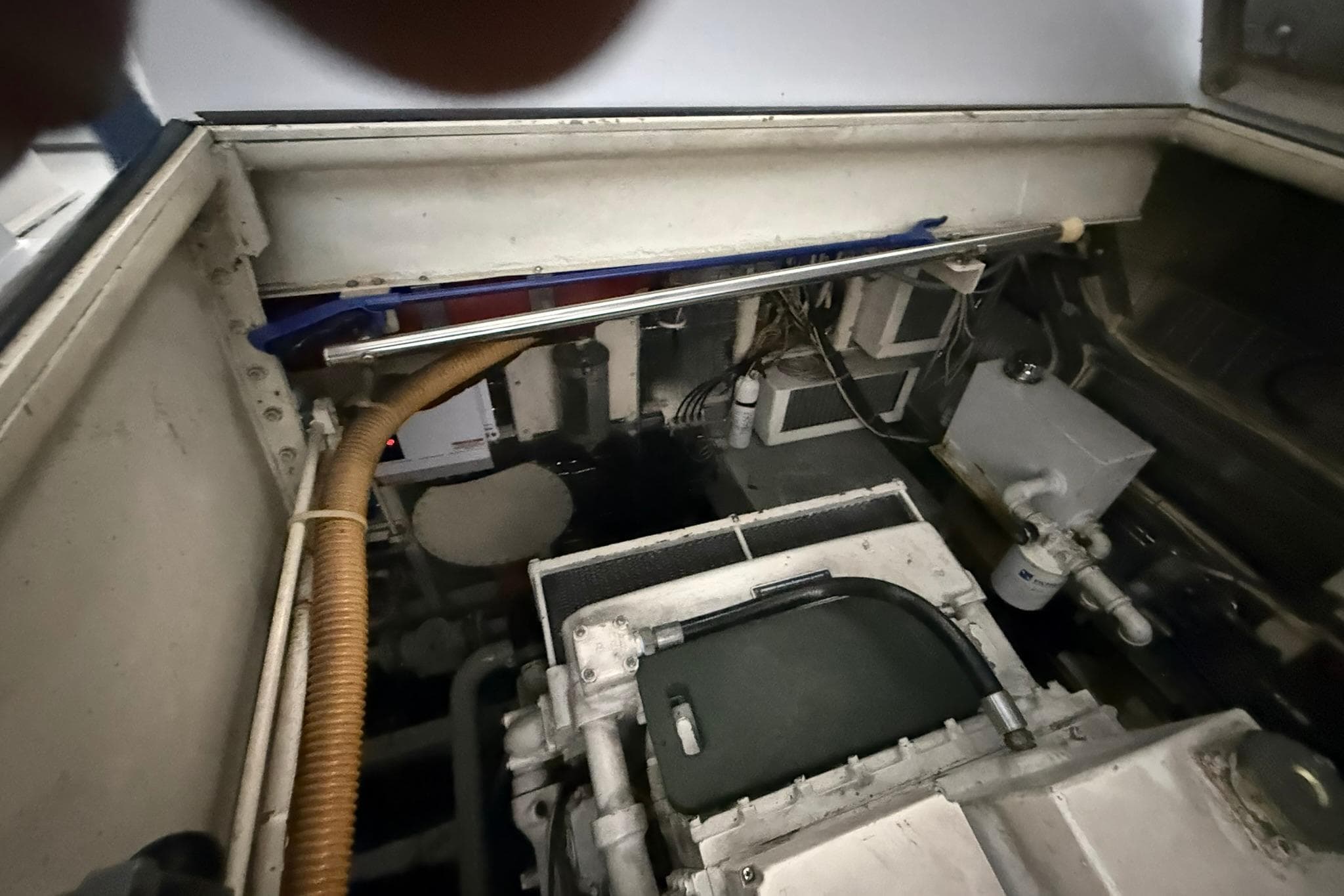 Engine compartment of a 1999 Diaship 53 boat, showing mechanical components and wiring.