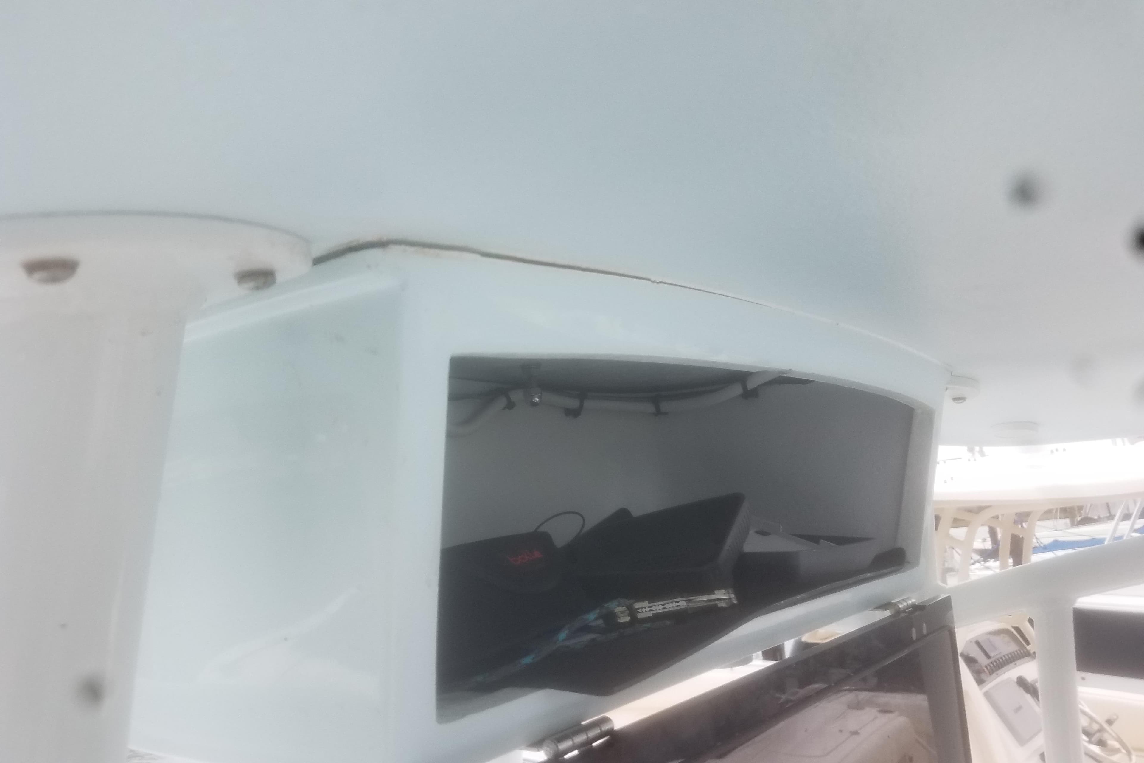 2020 Hells Bay Ester boat interior storage compartment with visible equipment.