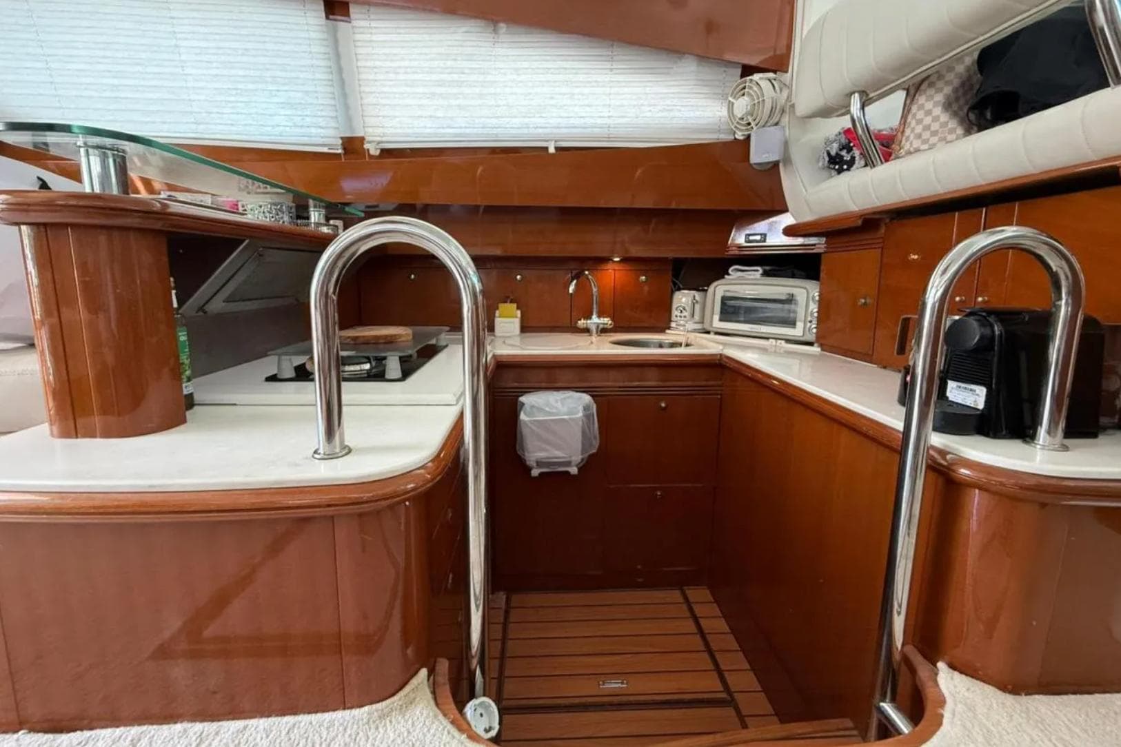 Luxurious kitchen interior of 2005 Jeanneau Prestige 46 yacht with modern appliances.