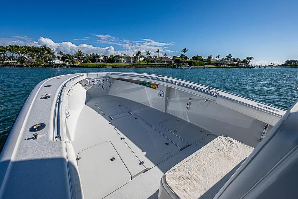 2002 Yellowfin 36 Offshore boat on calm water, clear sky, coastal view.