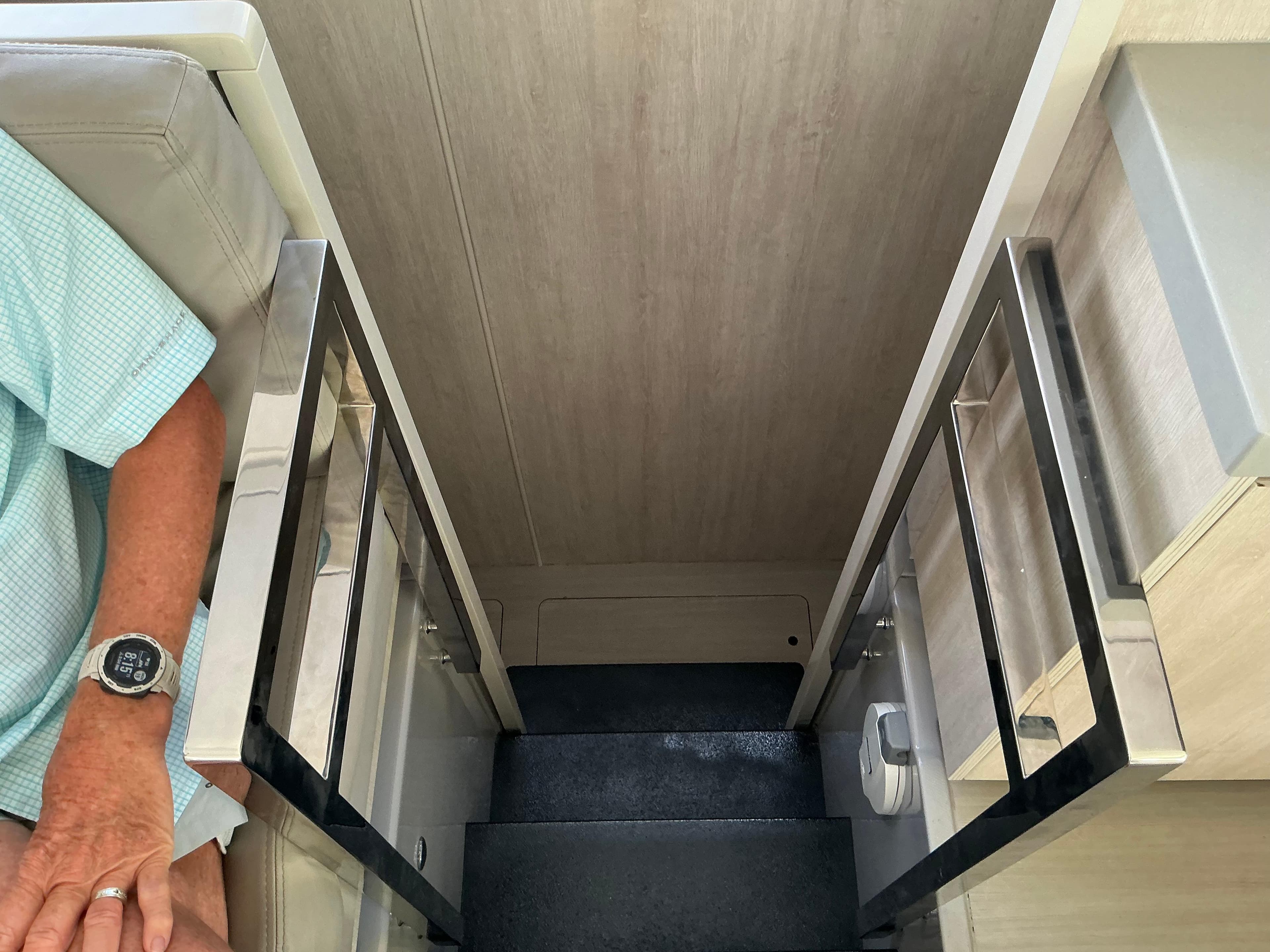 Staircase inside 2019 Leopard 51 Powercat yacht with modern railing design.