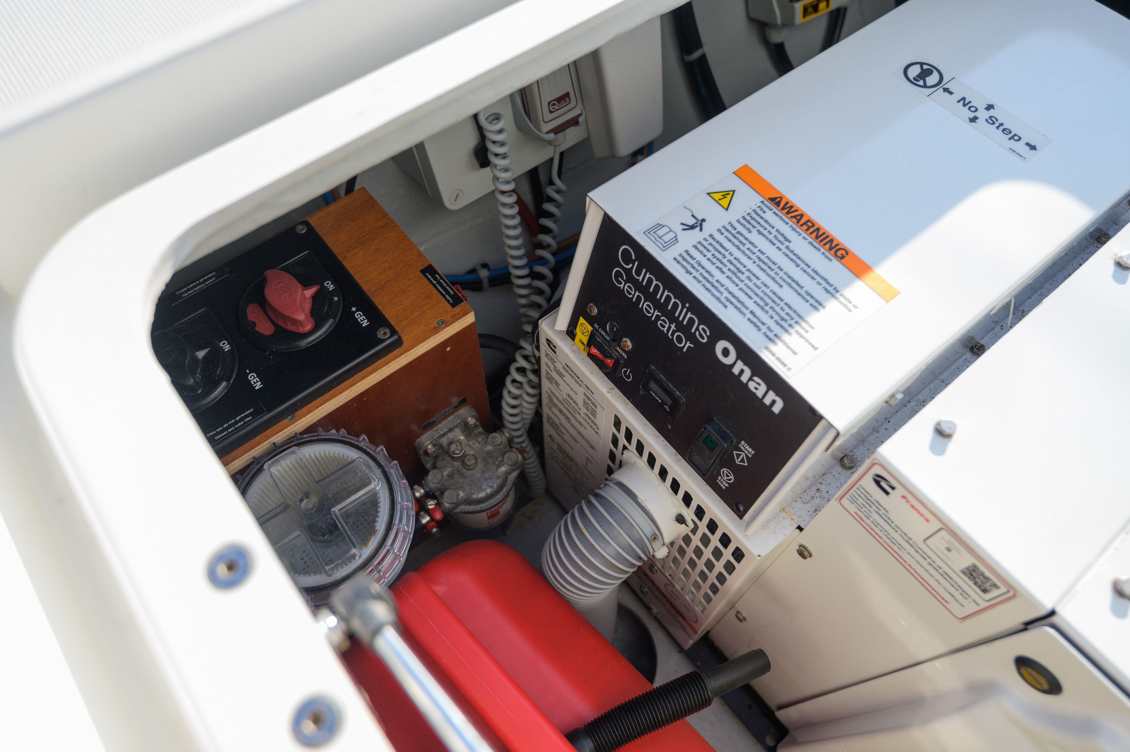 Engine compartment of 2019 Lagoon 42 with Cummins Onan generator and control panel.