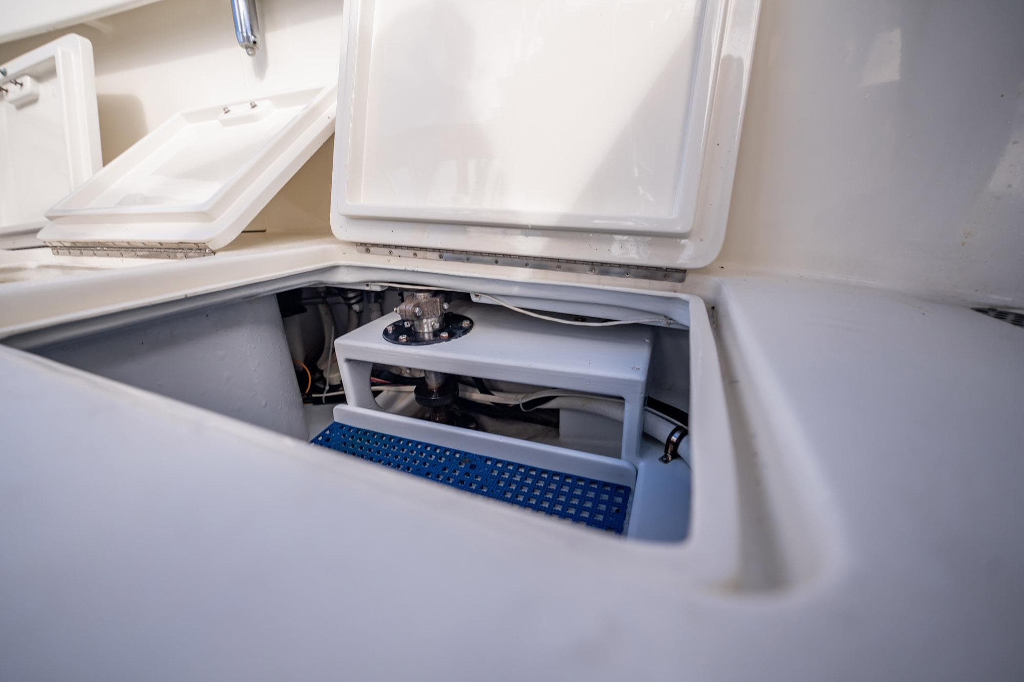 Open storage compartment on 2003 Gamefisherman 34 Express boat, showcasing interior details.