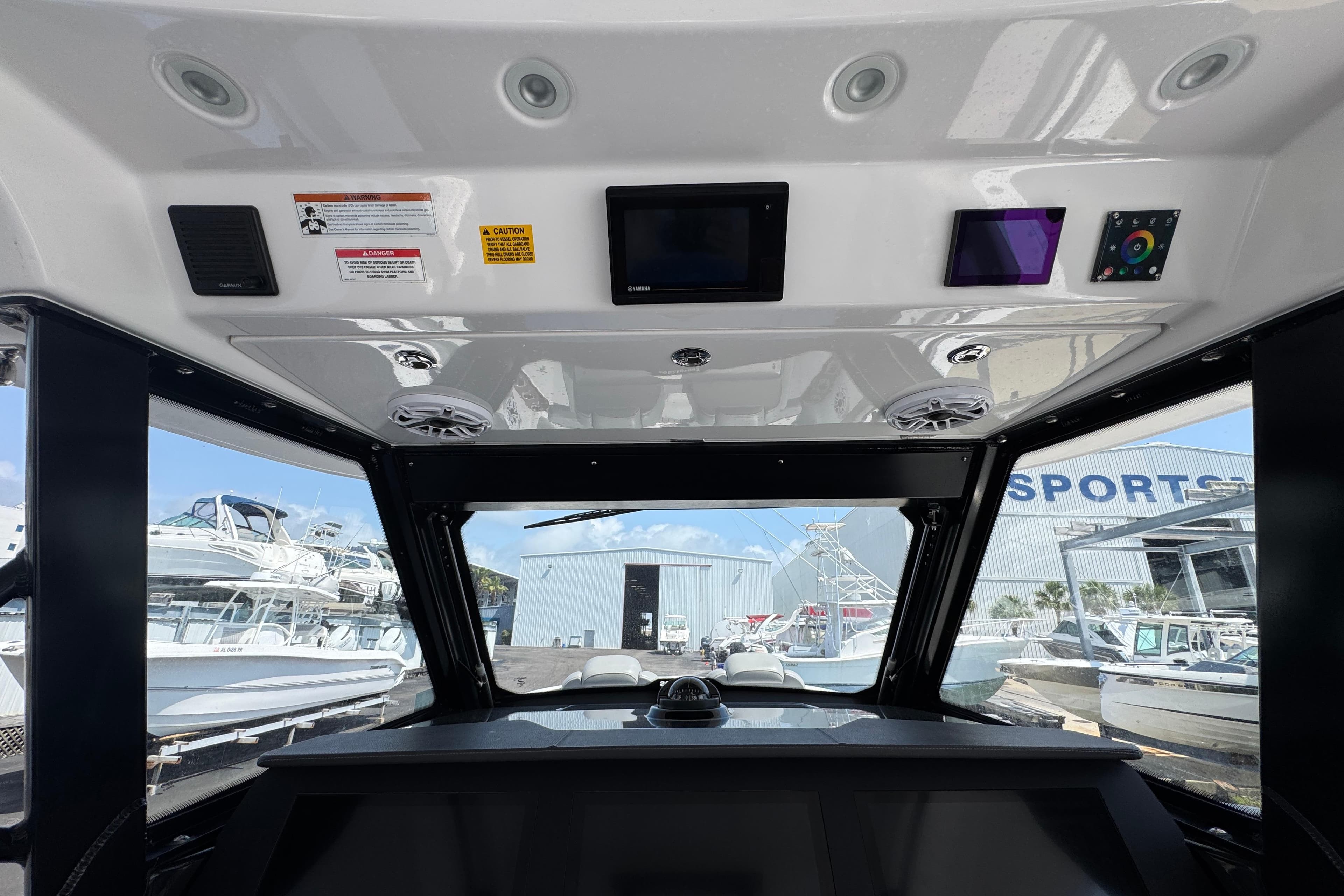 Interior view of 2022 Everglades 395 Center Console boat dashboard and controls.