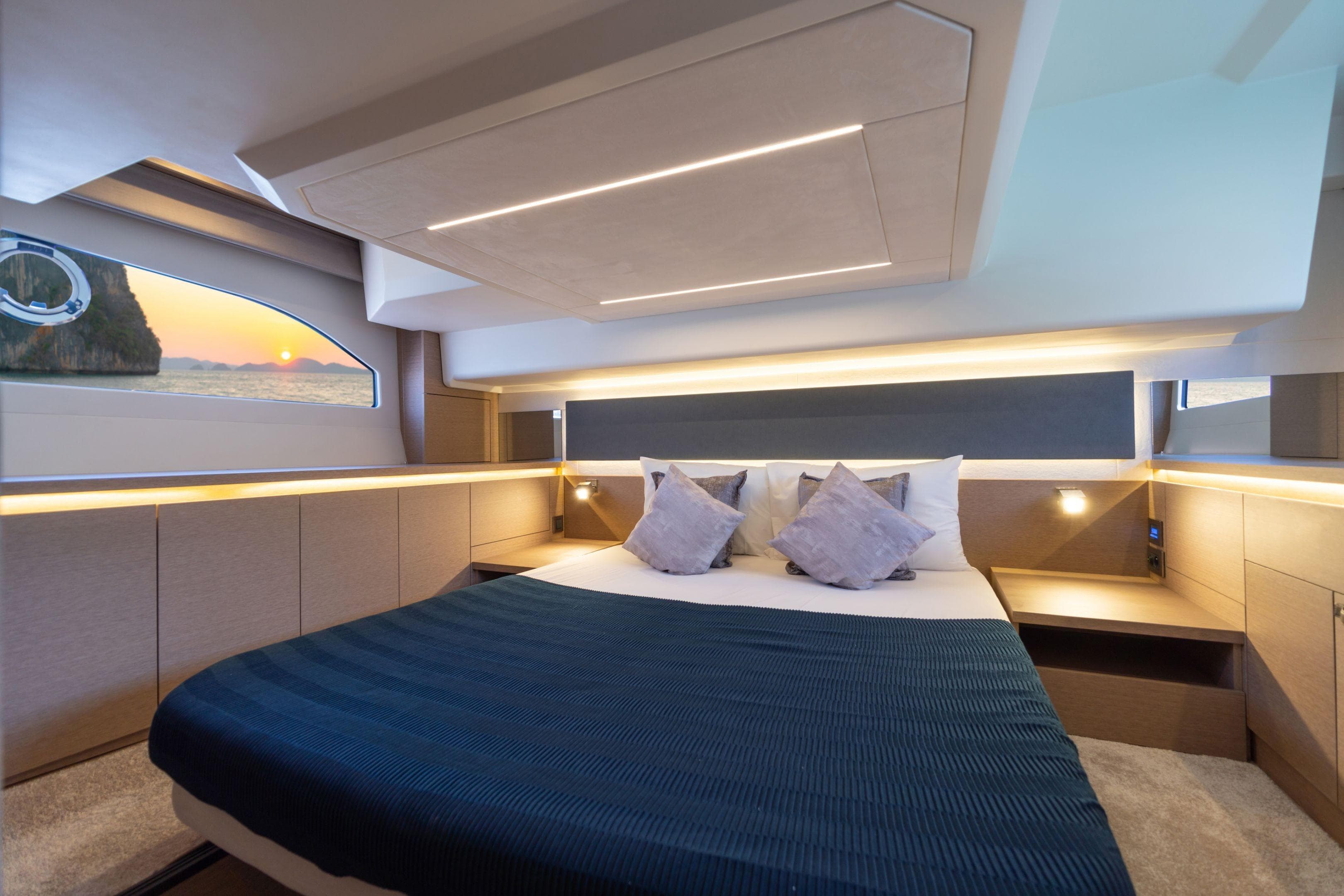 Luxurious cabin interior of 2026 Prestige 420 yacht with sunset view.