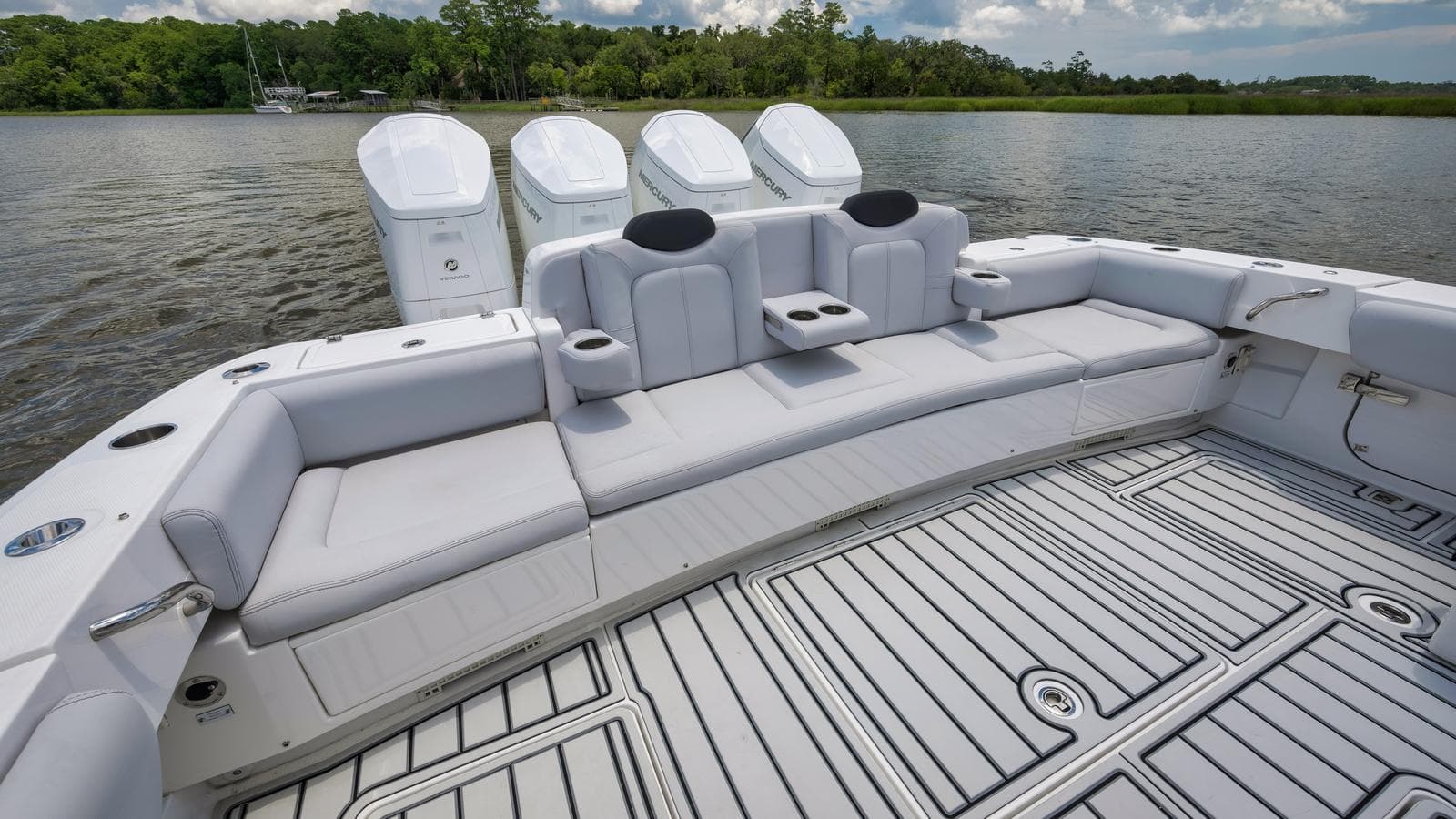 2021 HCB Suenos boat with spacious seating and four powerful outboard engines.