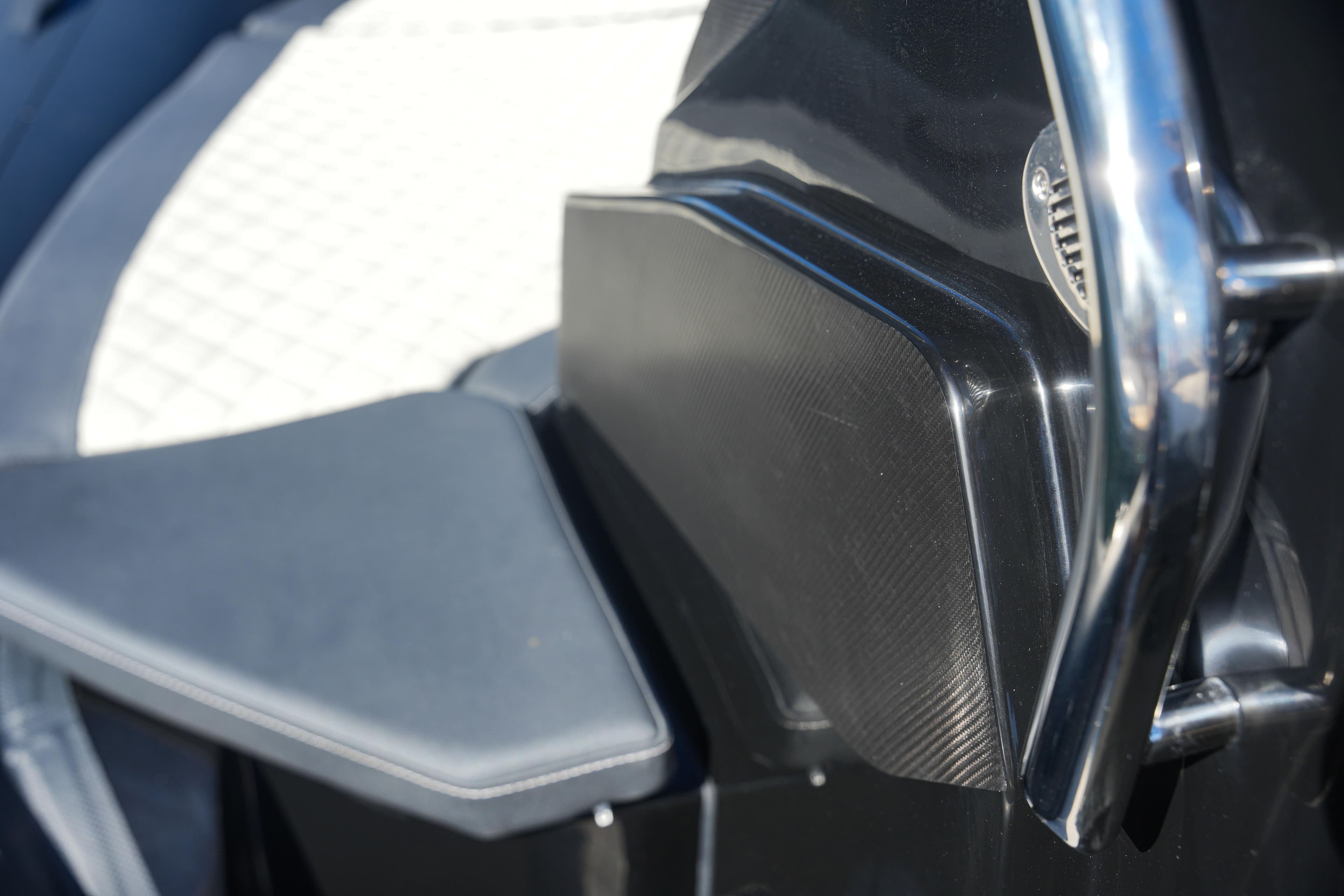 Close-up of 2023 SPX RIB 25 Dinette boat interior with sleek black and white design.