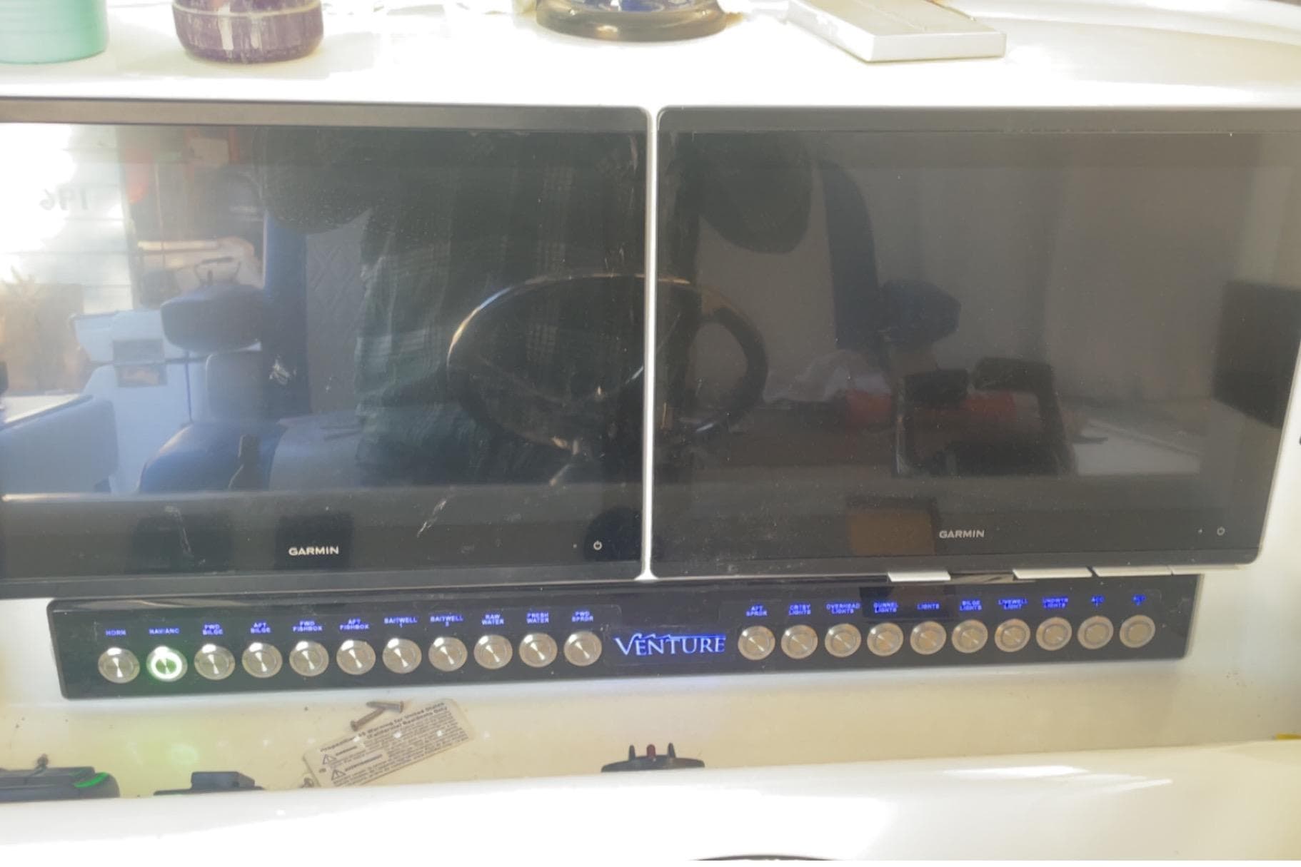 Control panel of a 2016 Venture 39 Forward Seating boat with dual Garmin screens.