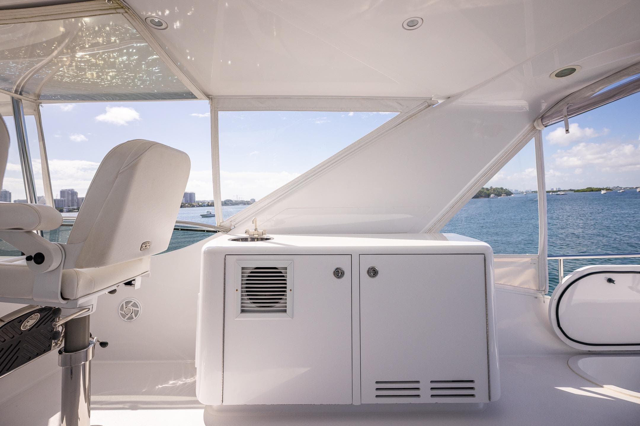 2009 Hatteras 64 Motor Yacht helm with ocean view and seating.