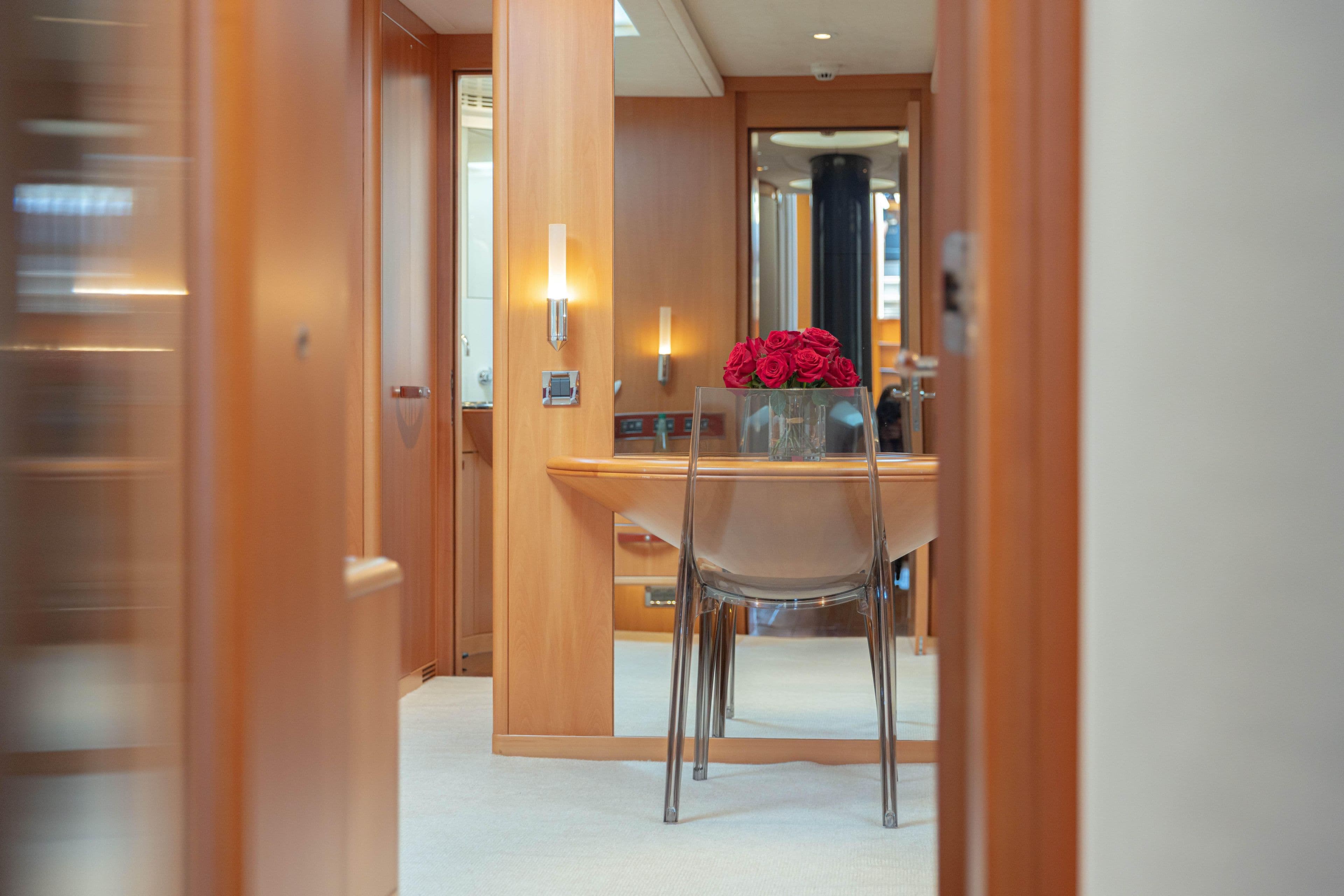 Luxurious interior of 2006 Holland Jachtbouw 37 yacht with elegant wooden decor and roses.
