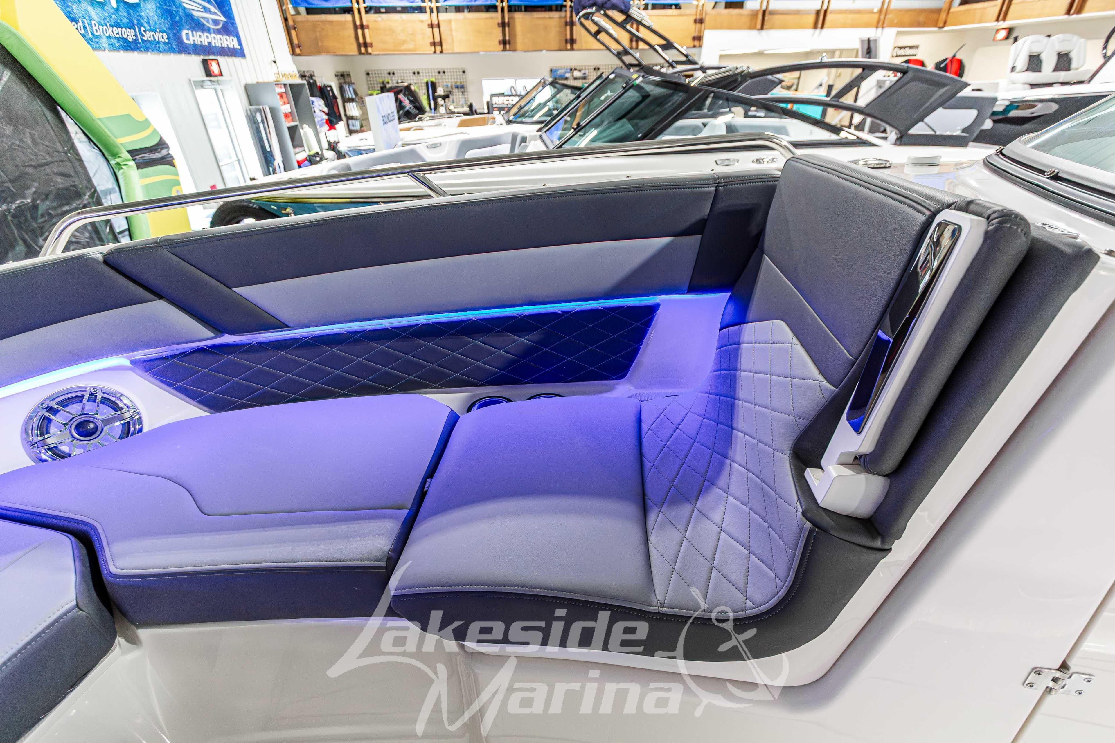Luxurious interior of 2026 Chaparral SSX 6 boat with blue LED lighting.