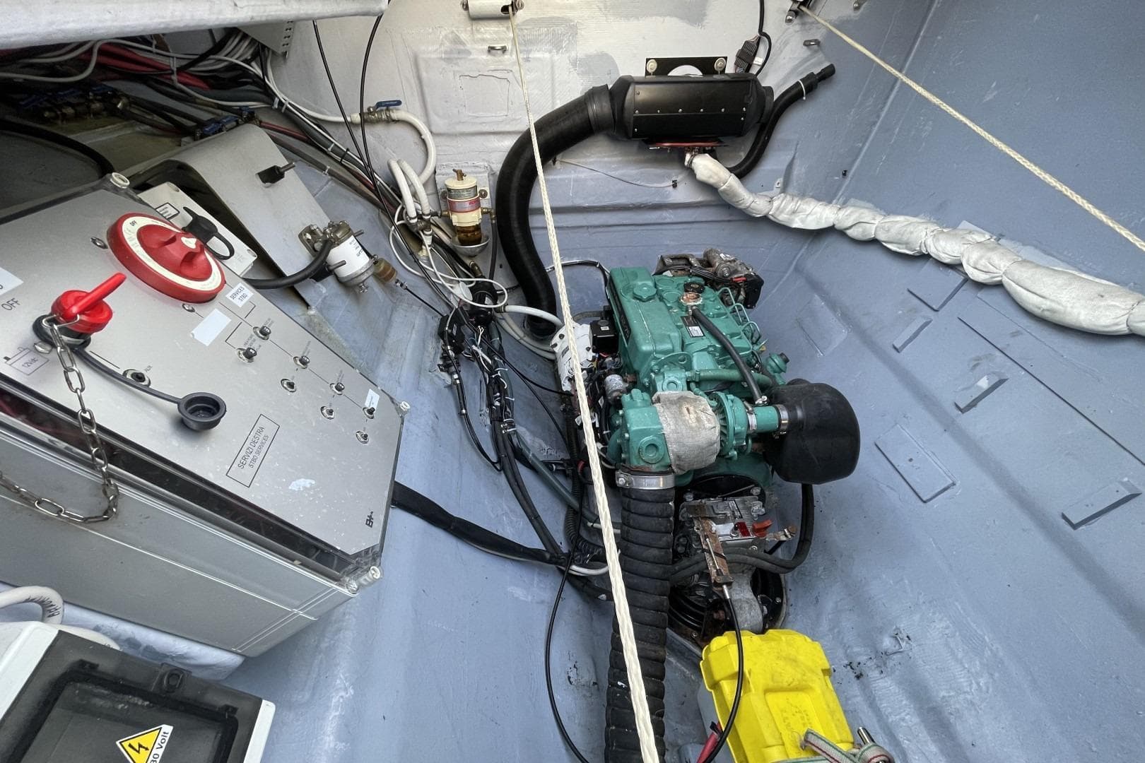 Engine room of 2017 Ice Yachts Ice Cat 61, featuring mechanical components and control panel.
