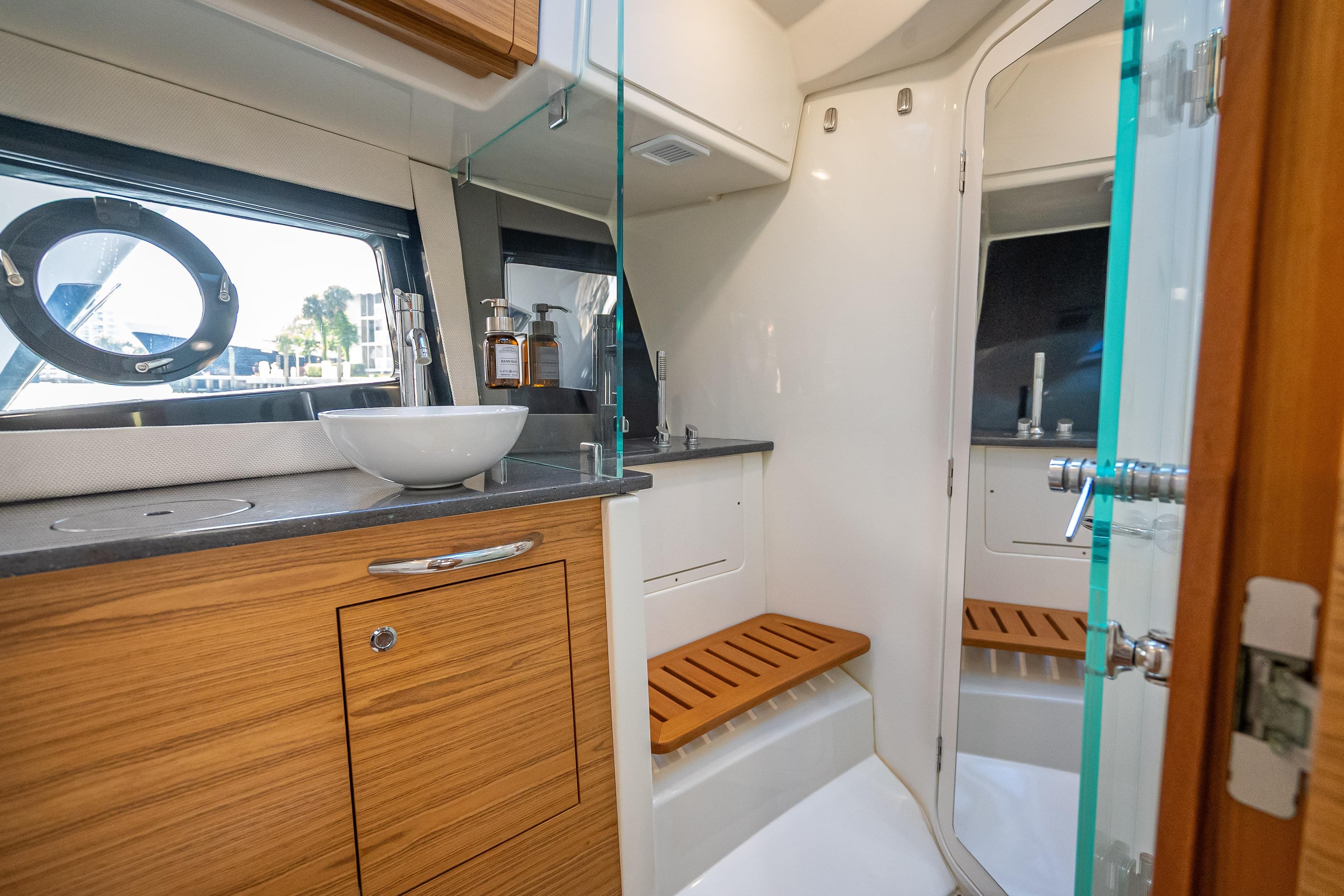 Luxurious bathroom interior of 2021 Boston Whaler 405 Conquest yacht with modern fixtures.