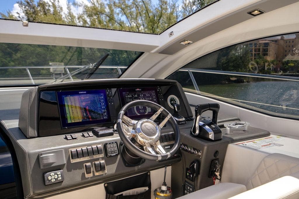 Interior cockpit of 2022 Schaefer 400 Sport yacht with modern navigation controls.