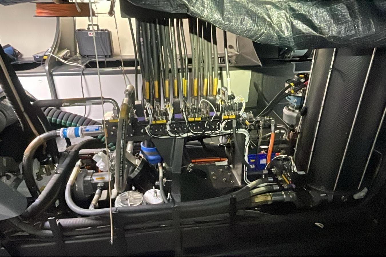Engine room of a 2009 Judel and Vrolijk Maxi 72 yacht, showcasing complex machinery.