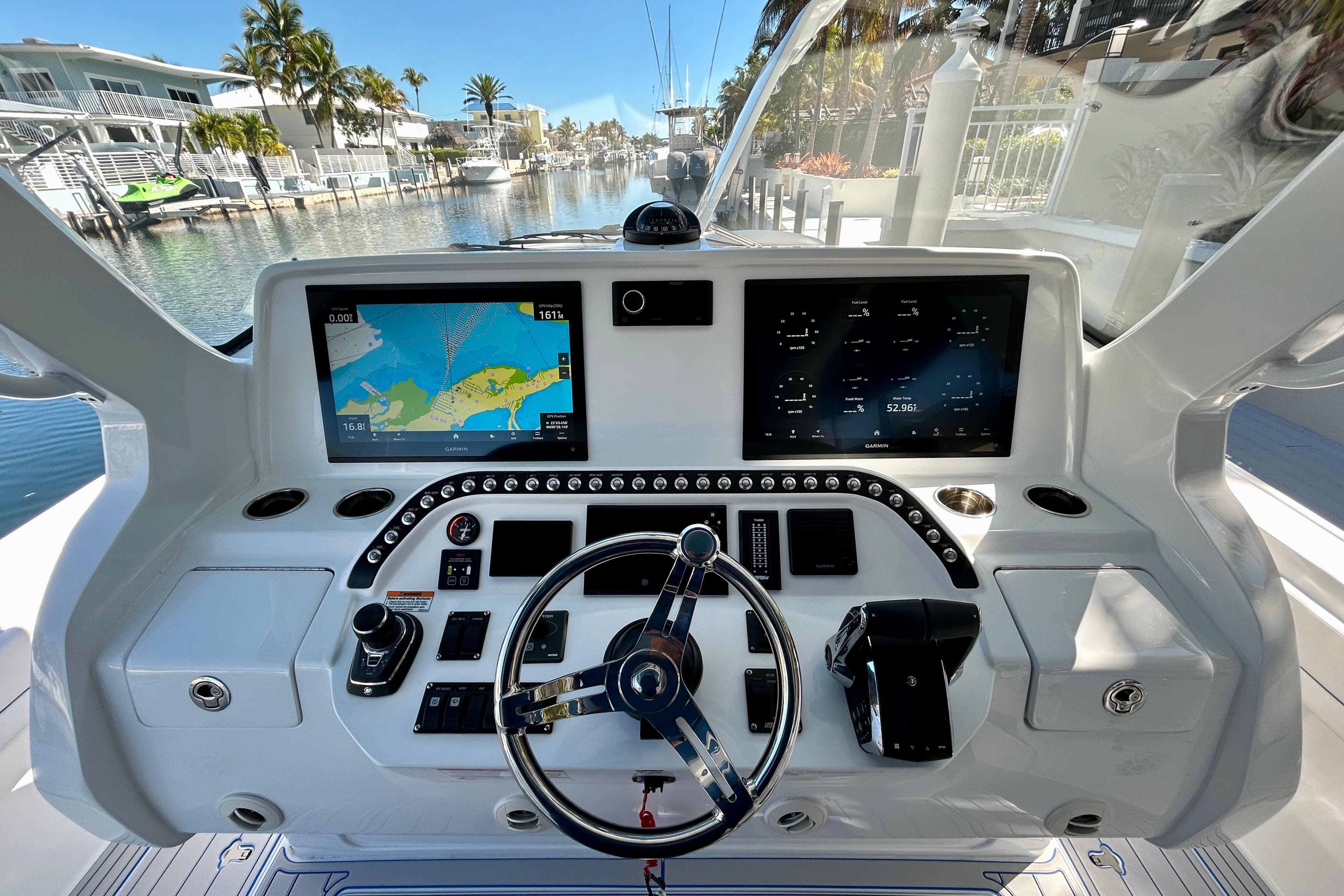 Helm of 2025 Intrepid 43 Nomad SE with advanced navigation displays and controls.