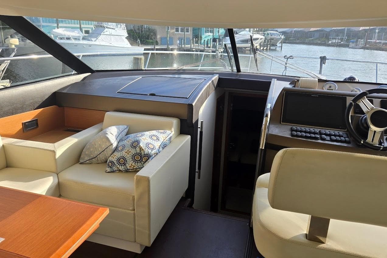 Interior of 2013 Prestige 500 yacht with helm, seating, and navigation equipment.
