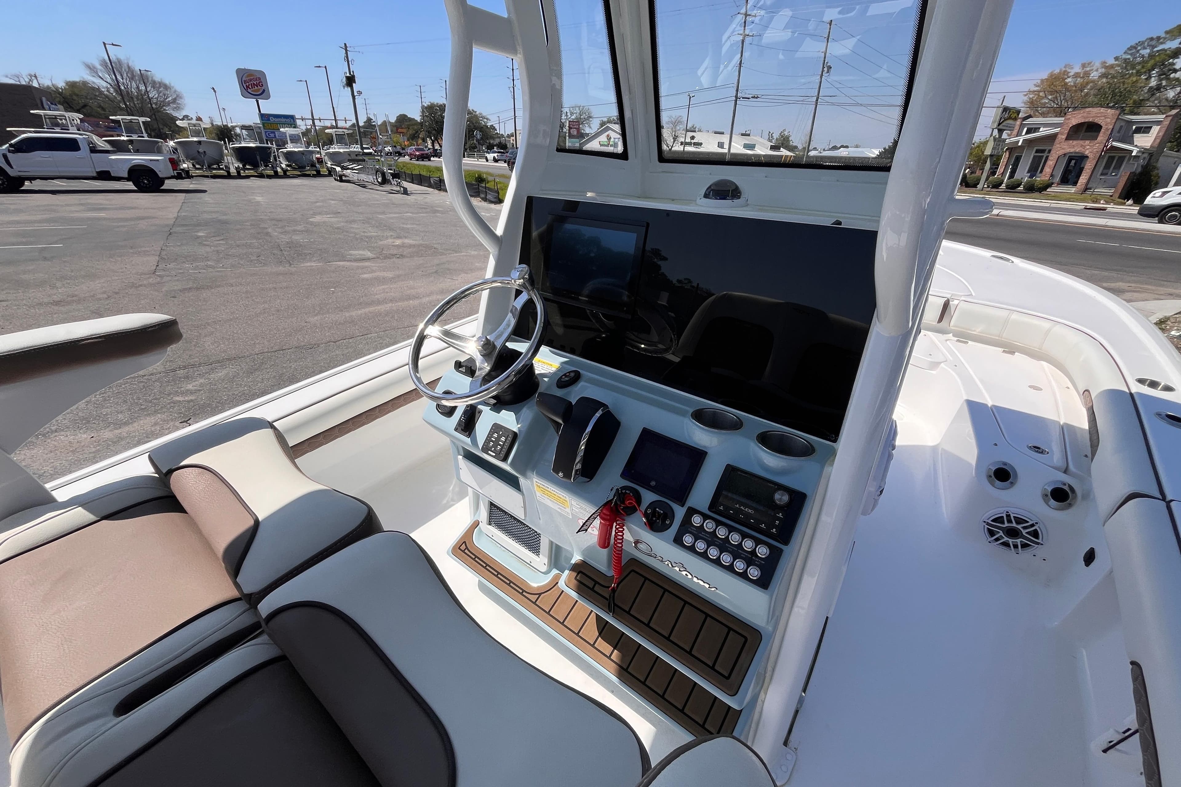2025 Tidewater 2500 Carolina Bay boat cockpit with steering wheel and control panel.