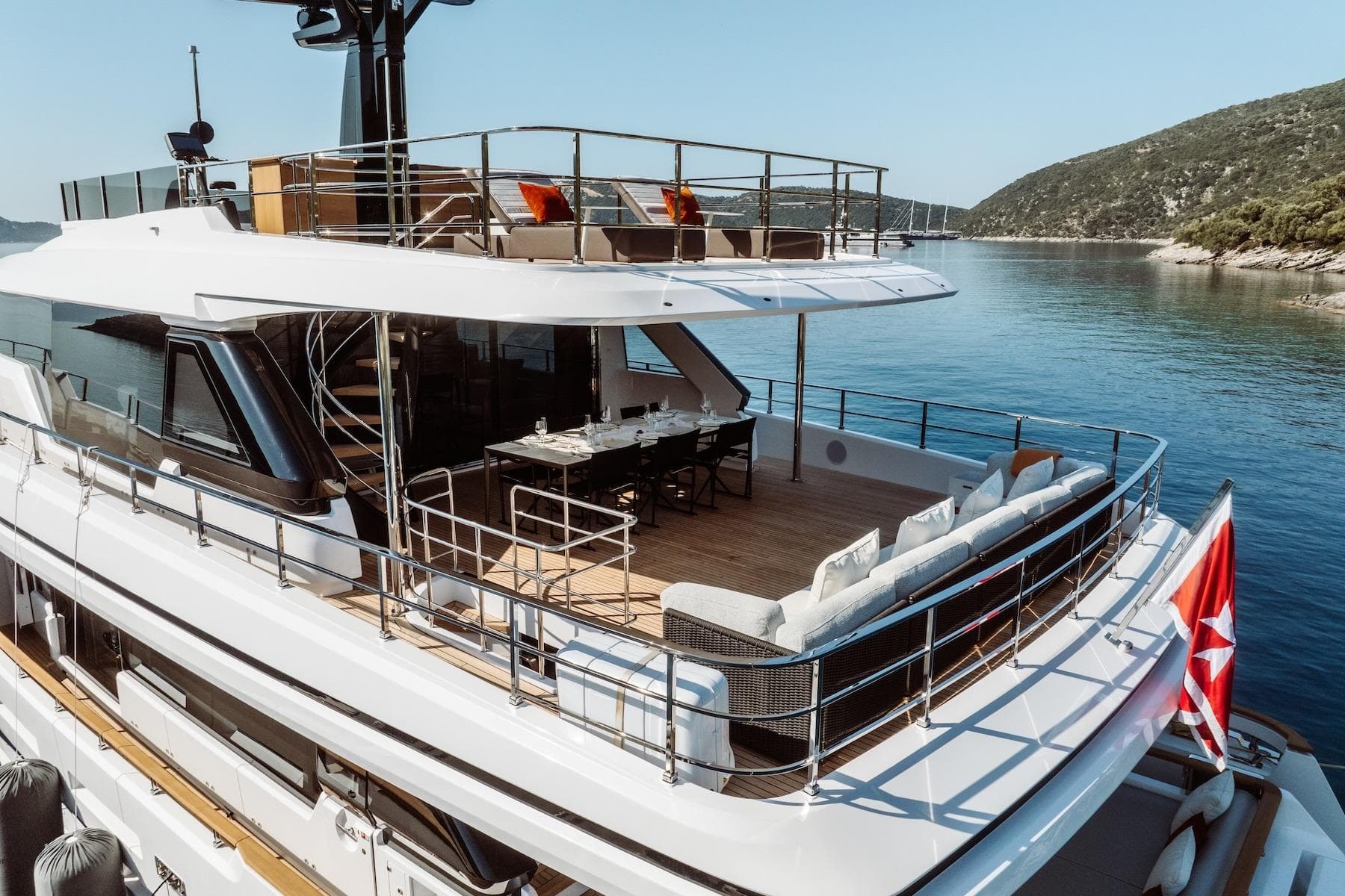 Luxurious 2024 Custom Line Navetta 30 yacht with spacious deck and scenic ocean view.