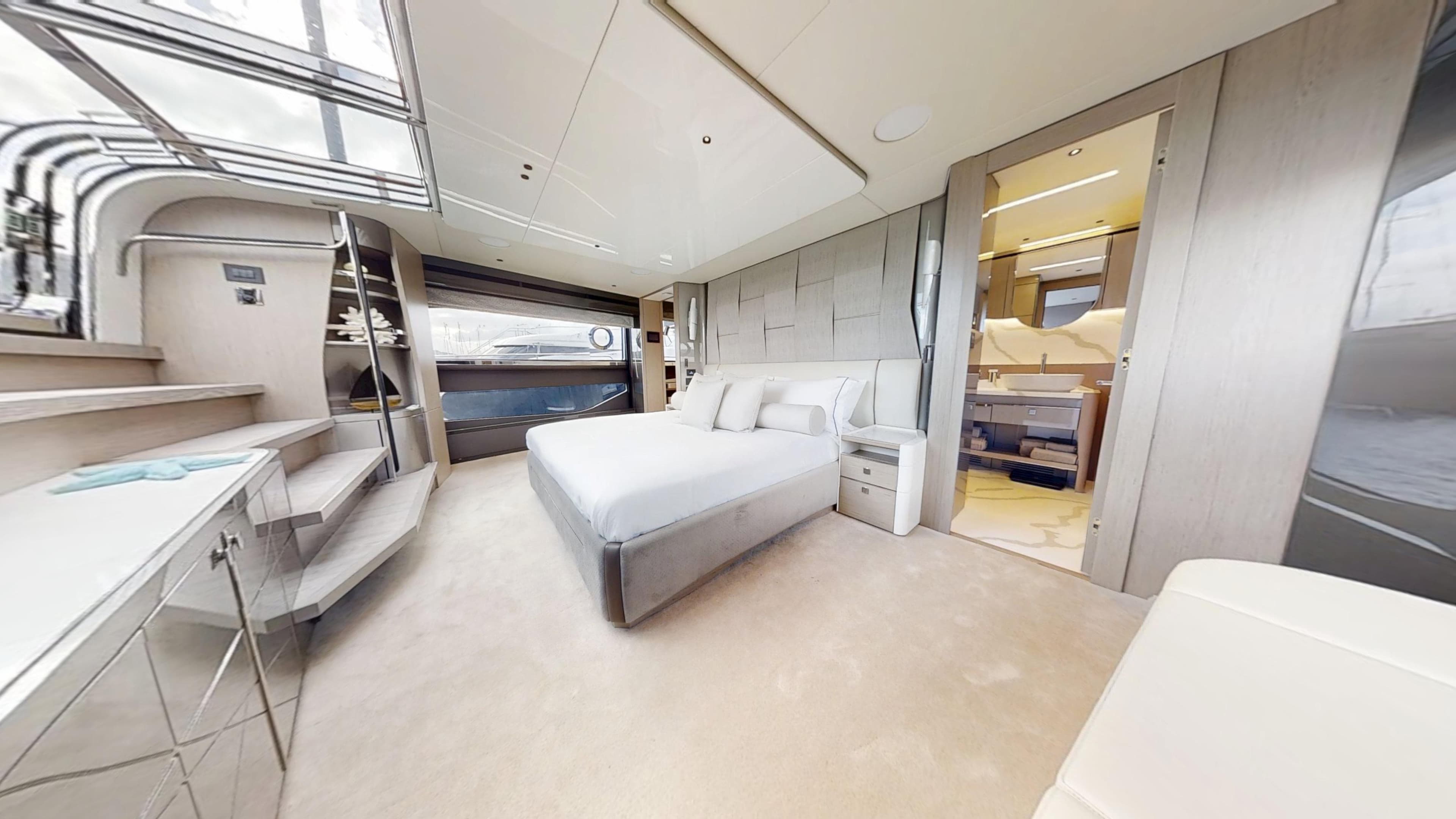 Luxurious bedroom interior of 2023 Sunseeker 100 Yacht with modern design and elegant furnishings.