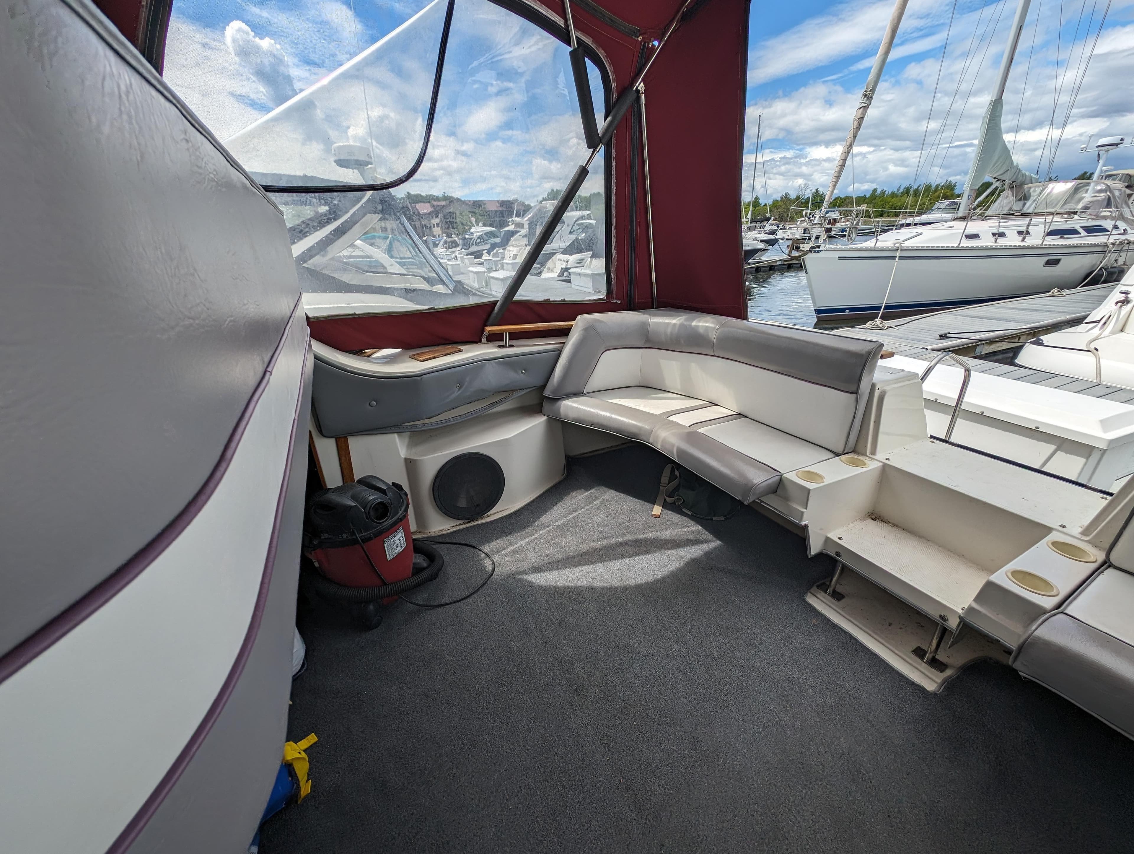 1987 Cruisers 3370 Esprit boat interior with seating and marina view.
