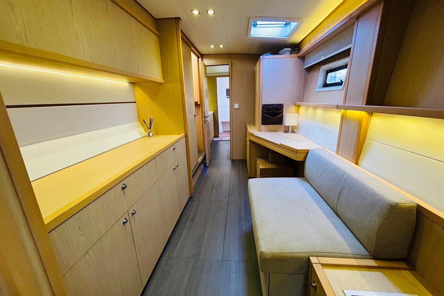 Luxurious interior of 2013 Lagoon 52F yacht with modern wood finishes and ambient lighting.