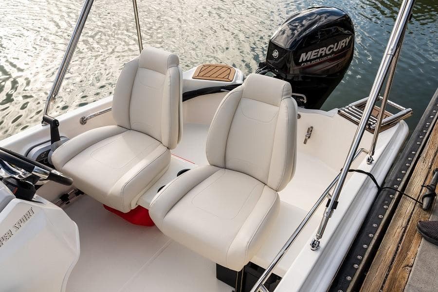 Manufacturer Provided Image: 2025 Boston Whaler 130 Super Sport boat interior with two white seats and Mercury engine.