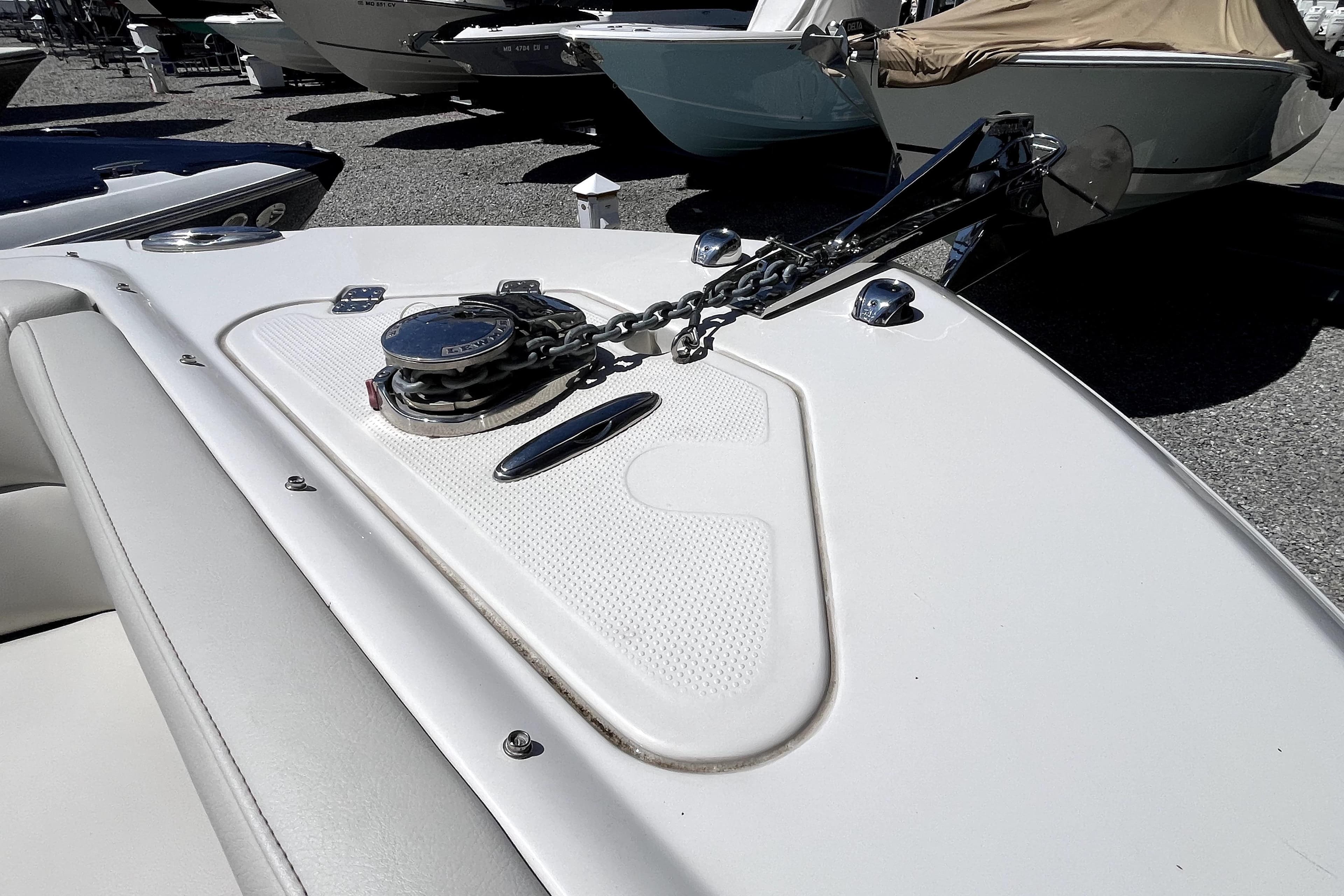 2024 Sailfish 245 DC boat anchor and chain on deck, displayed outdoors.