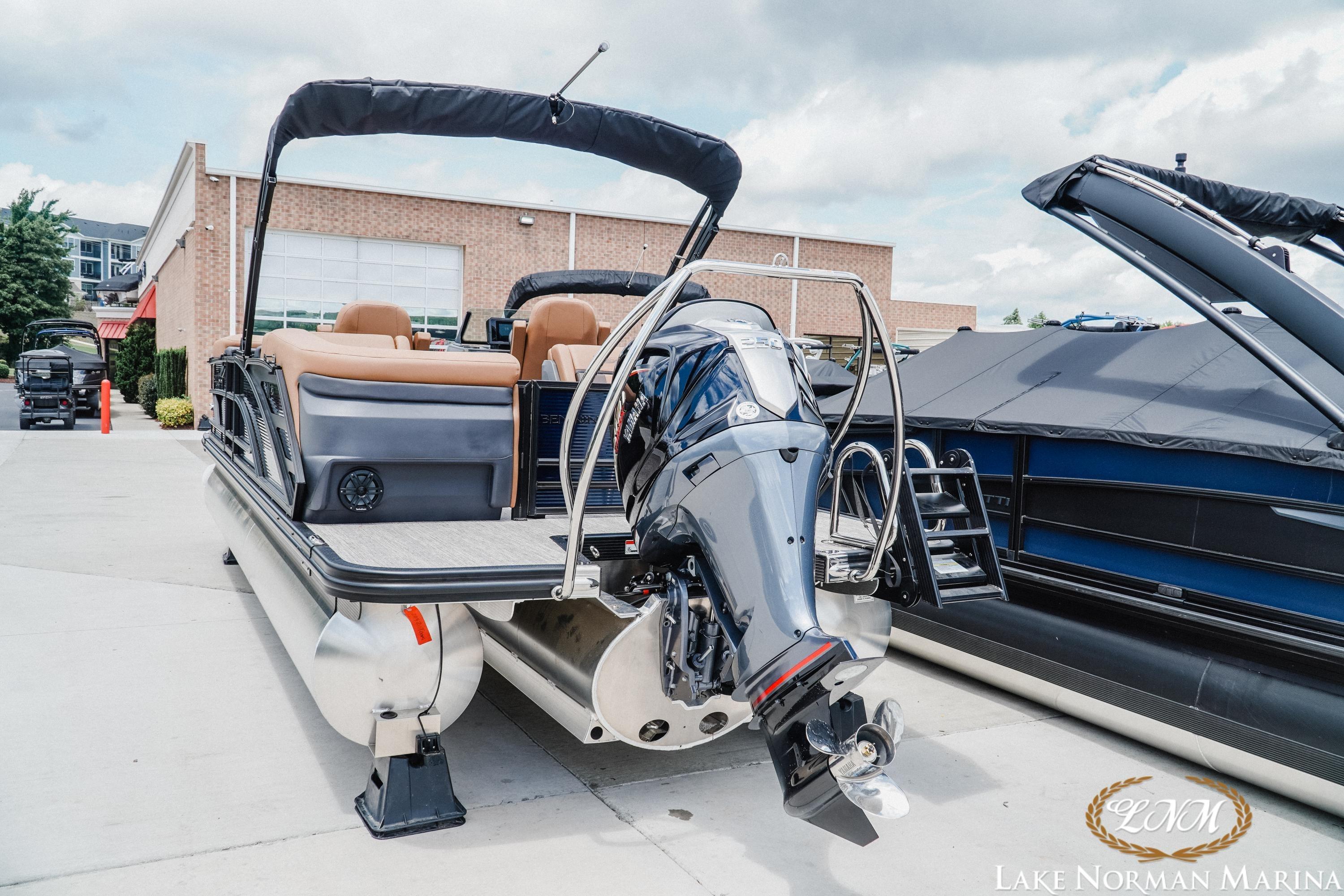 2026 Bennington 23MFB pontoon boat with outboard motor at Lake Norman Marina.